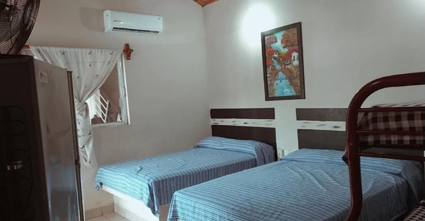 Bed in Bungalows Casa Regina