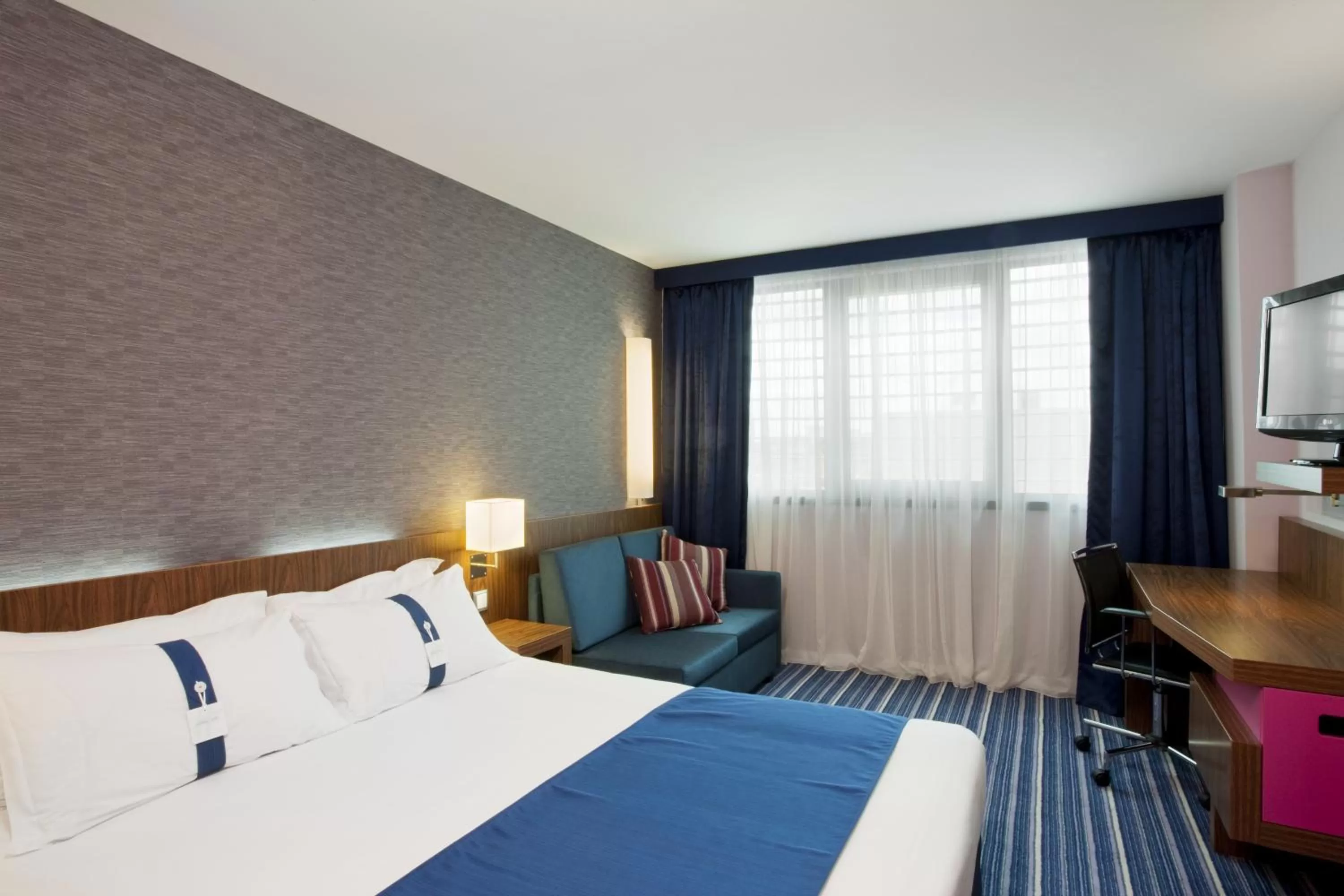 Photo of the whole room, Bed in Holiday Inn Express Lisbon Airport by IHG