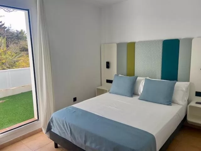 Bed in HOTEL BOUTIQUE CABO SUR