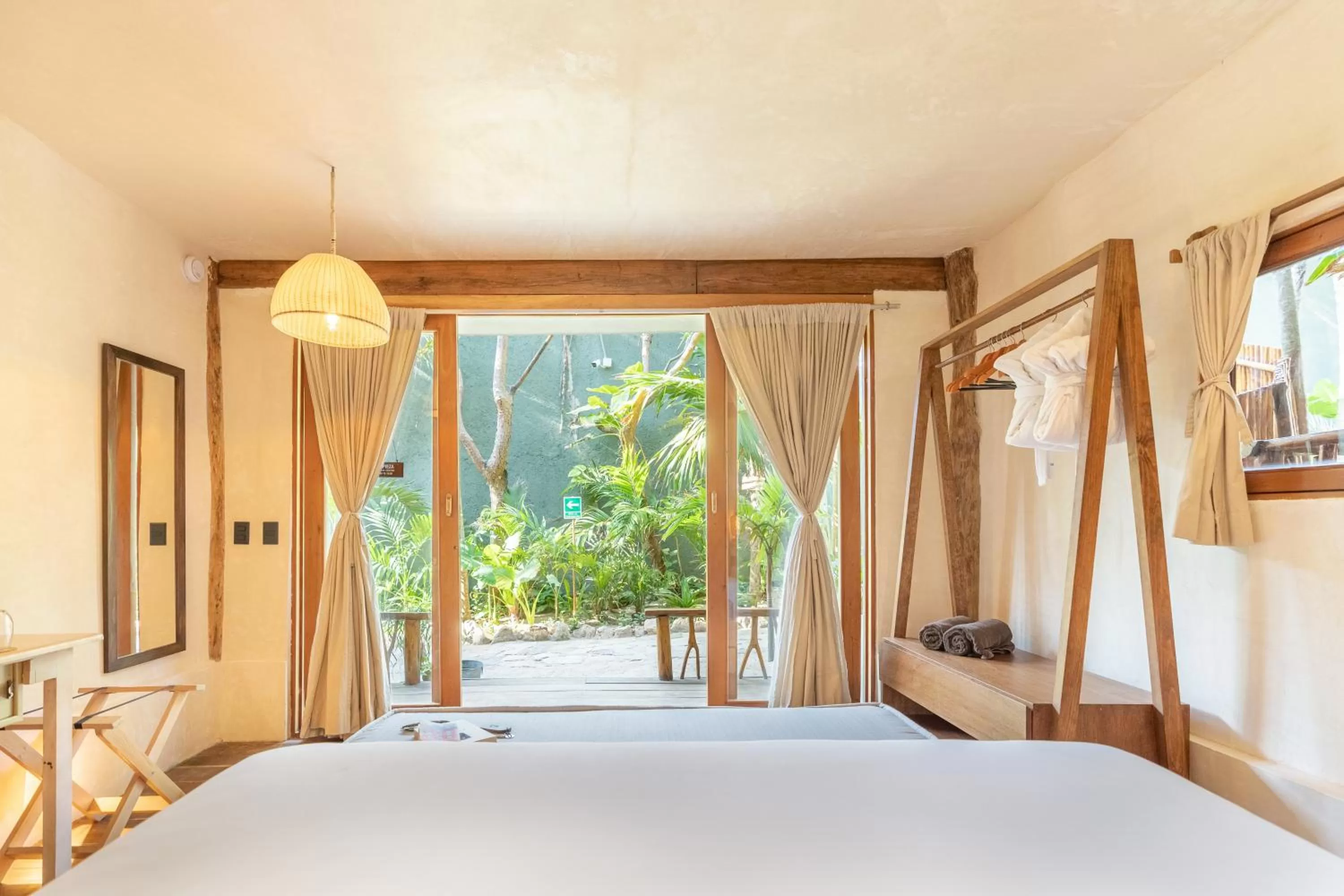 Bed in Casa Ganesh Tulum-Beachfront hotel by Ahau Collection