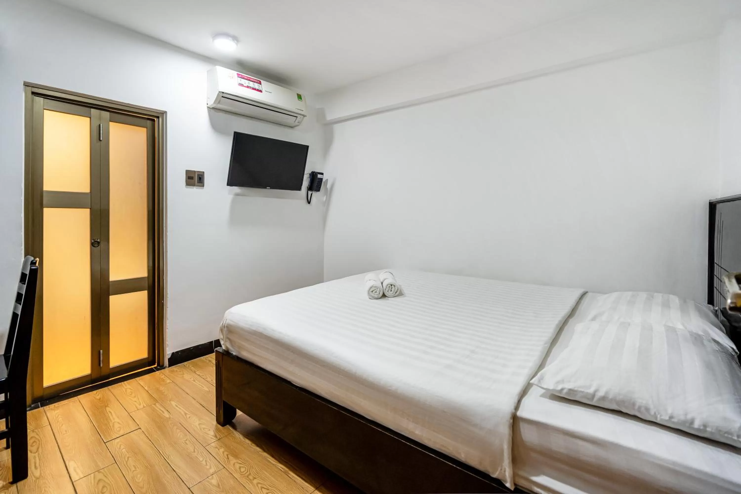 Bed in Lotus Laverne Hotel