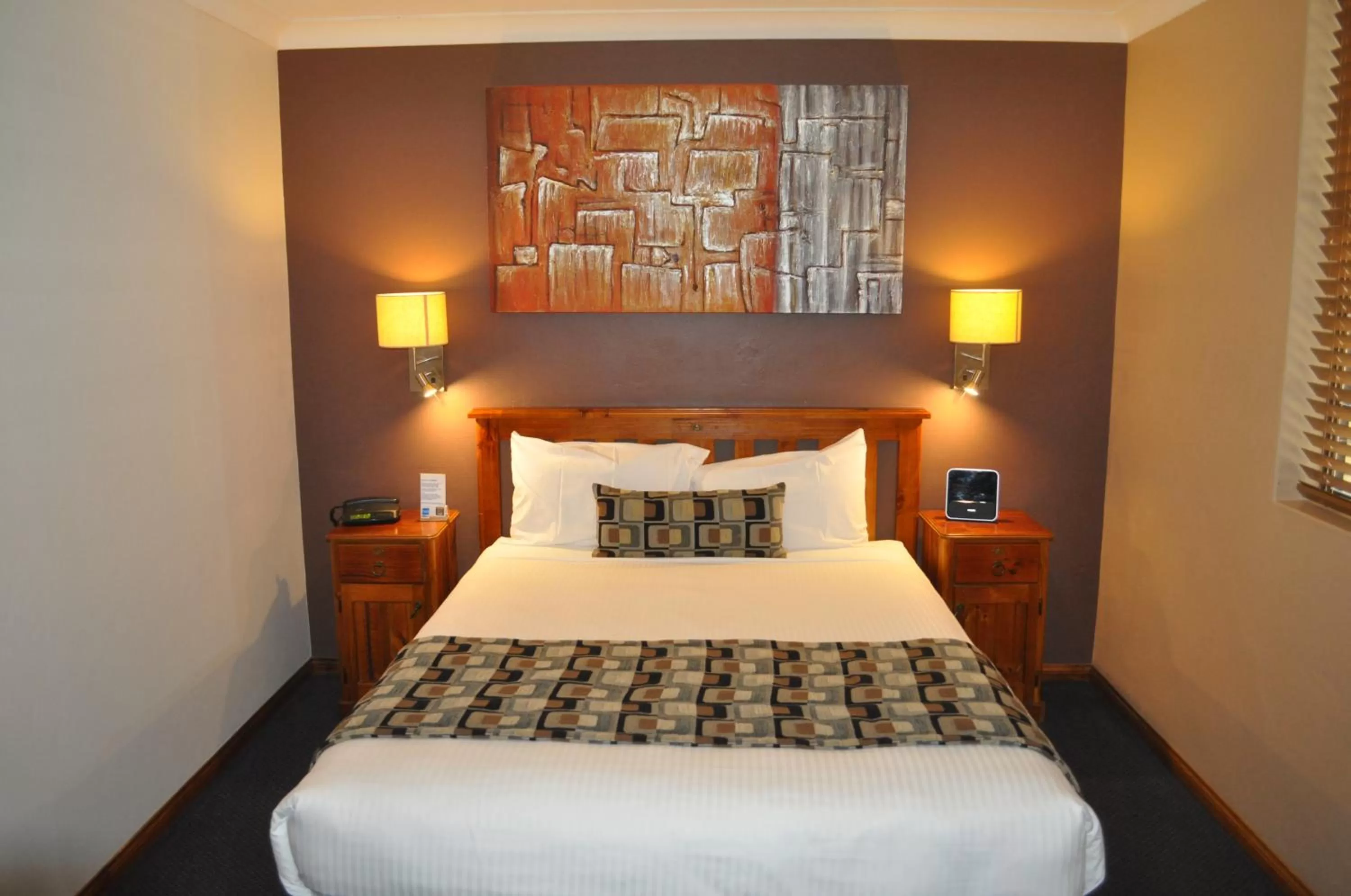 Bed in In Town Motor Inn