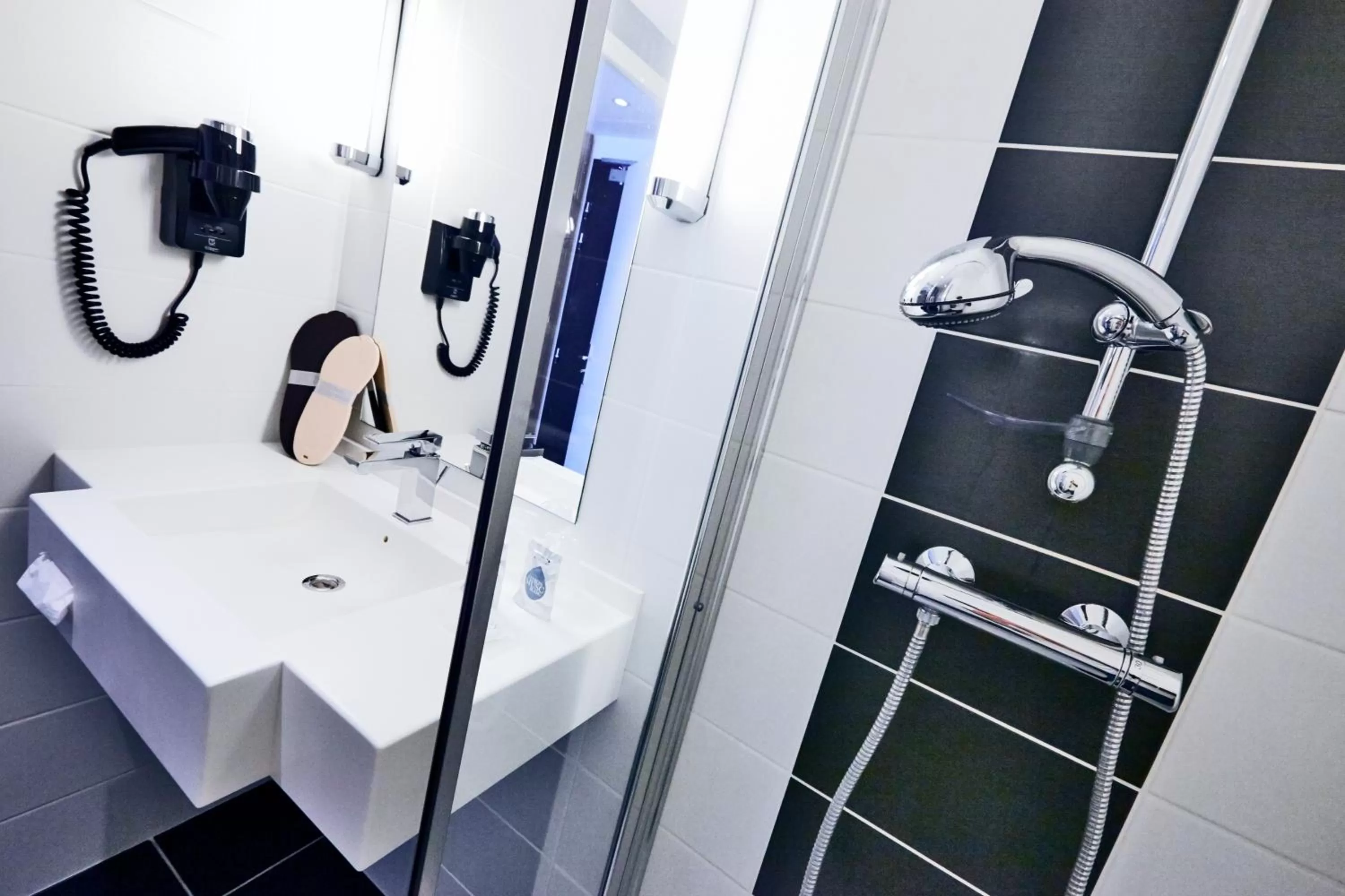 Bathroom in Kyriad Hotel Laval