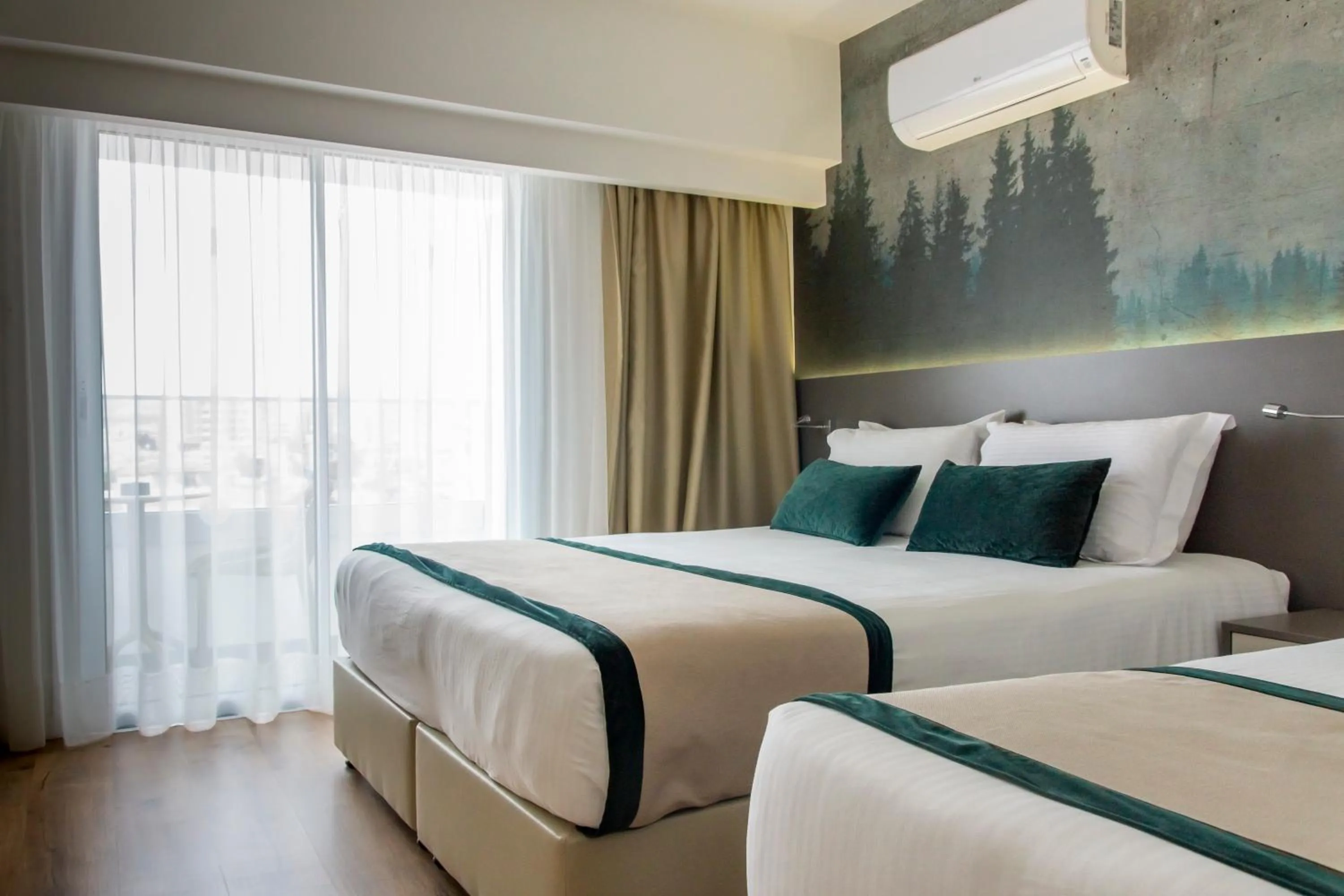 Bed in Pefkos City Hotel