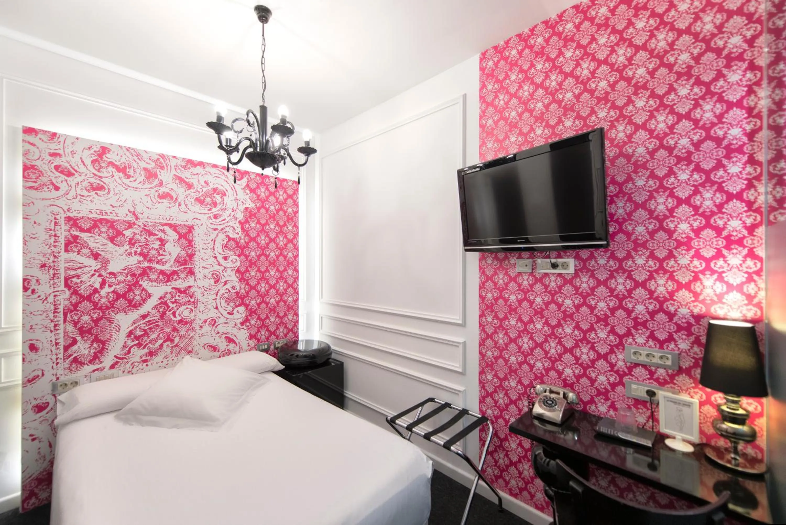 Bed in Posada del Dragón Boutique Hotel