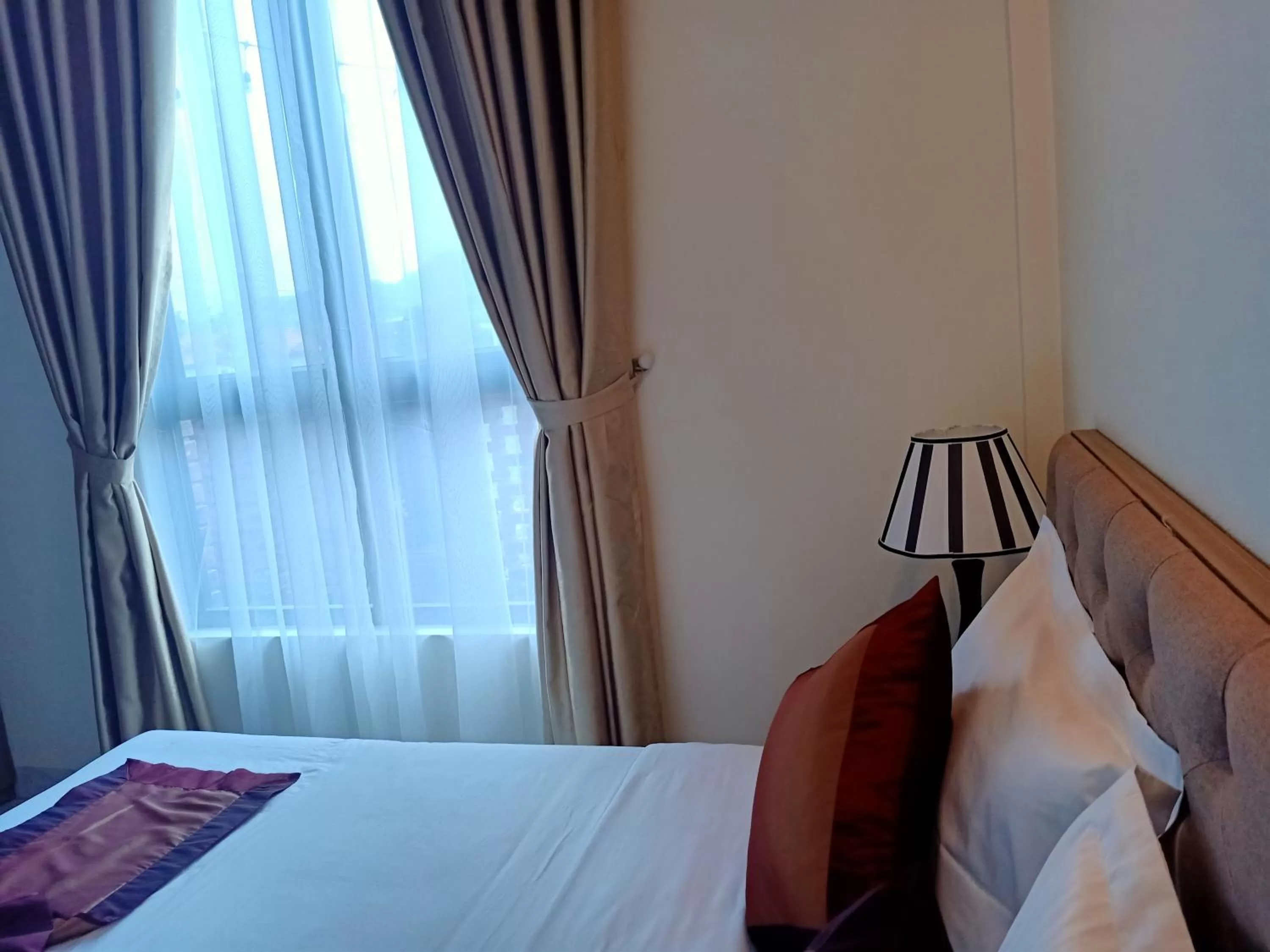 Bed in Cozynibi Hotel