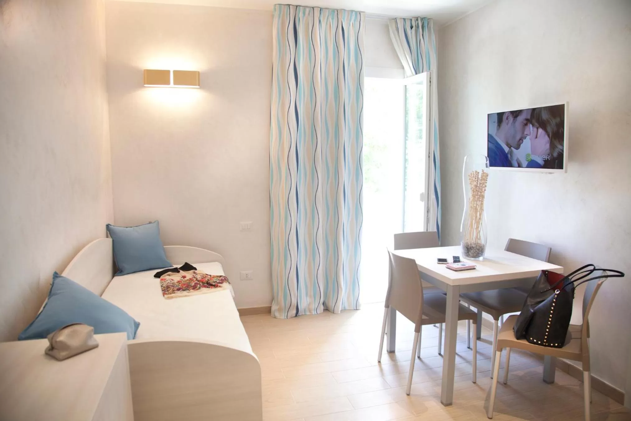 TV and multimedia in Marina Beach Suite Hotel