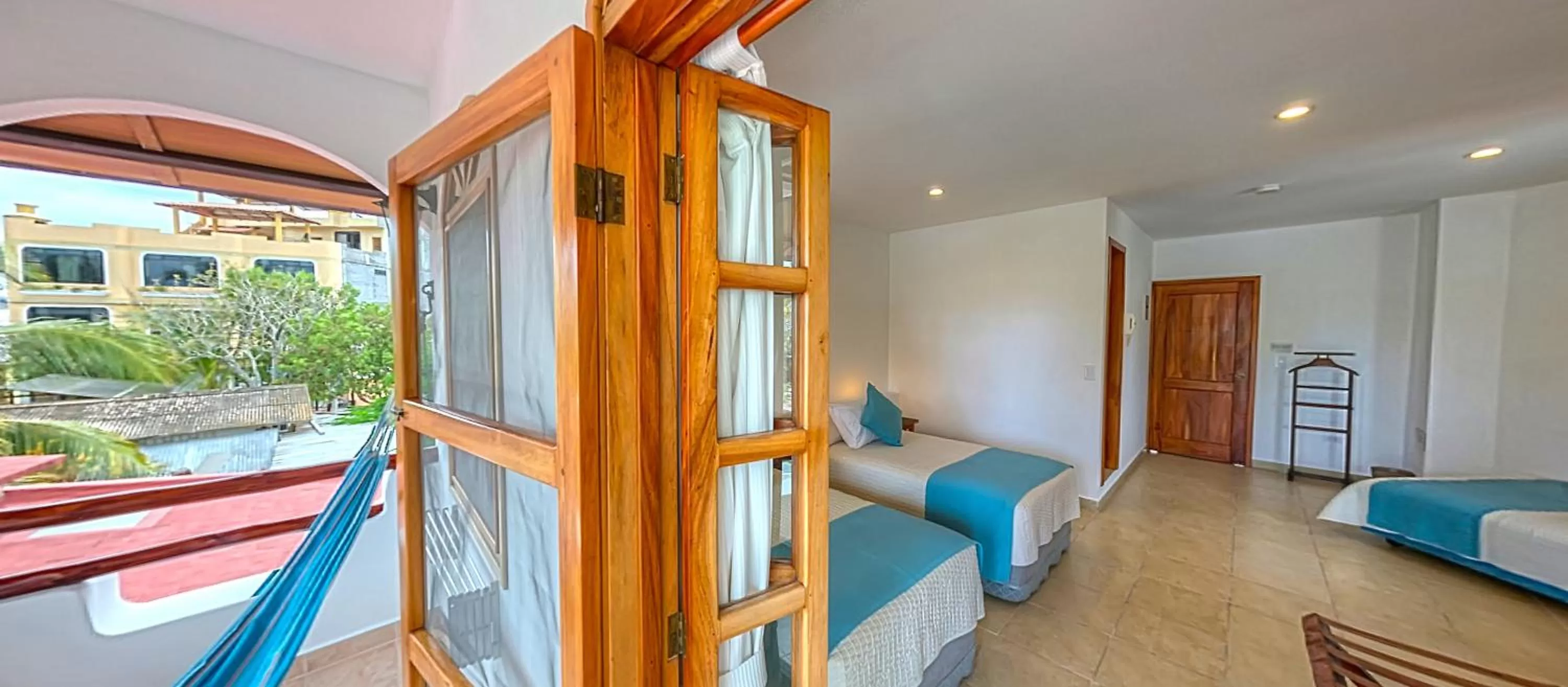 Bed in Hotel Galapagos Suites B&B