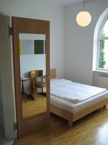 Bed in Art-Hotel Robert Mayer