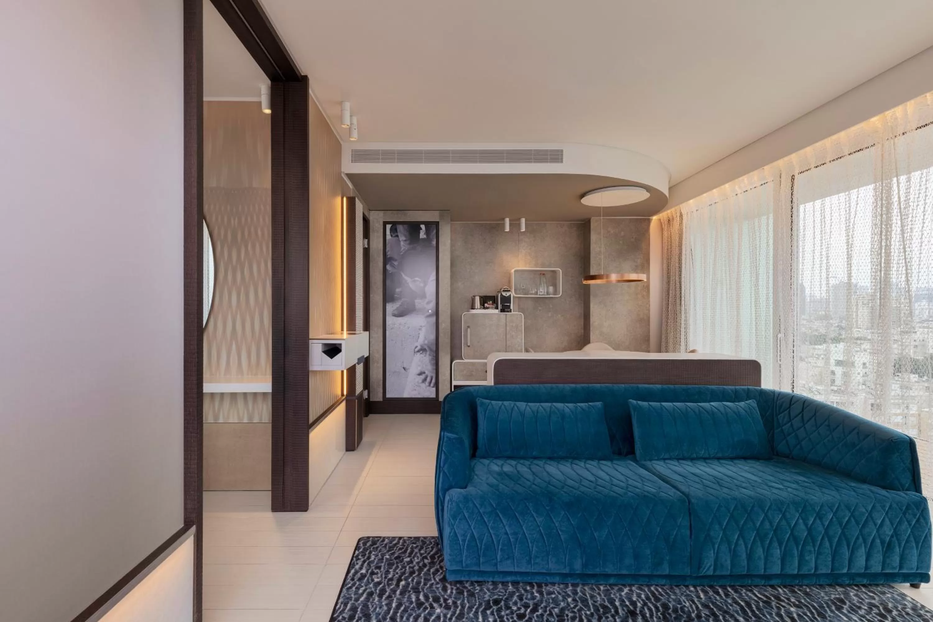 Living room, Bed in Port Tower by Isrotel Design