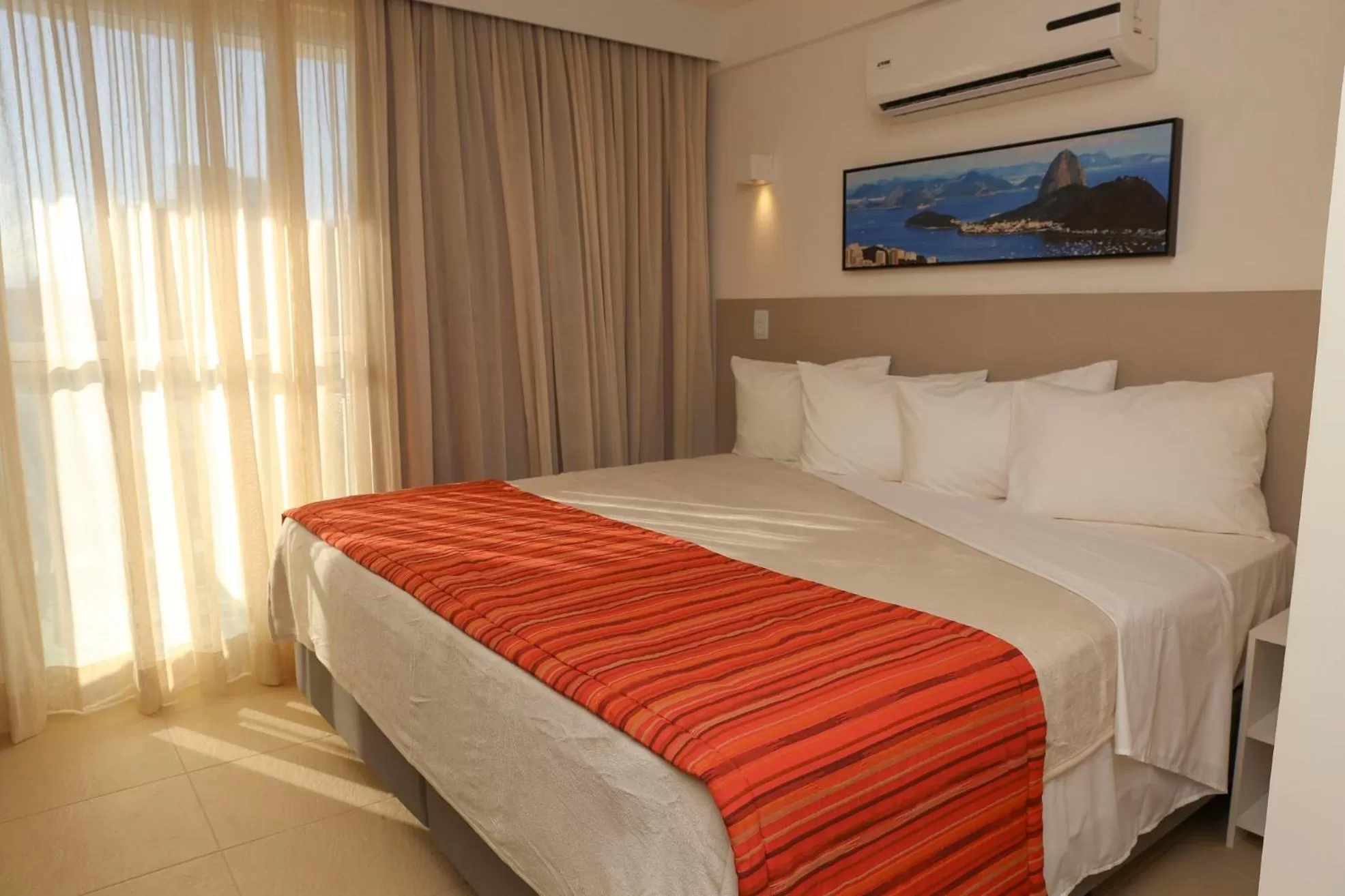Bed in Ramada by Wyndham Macae Hotel & Suites