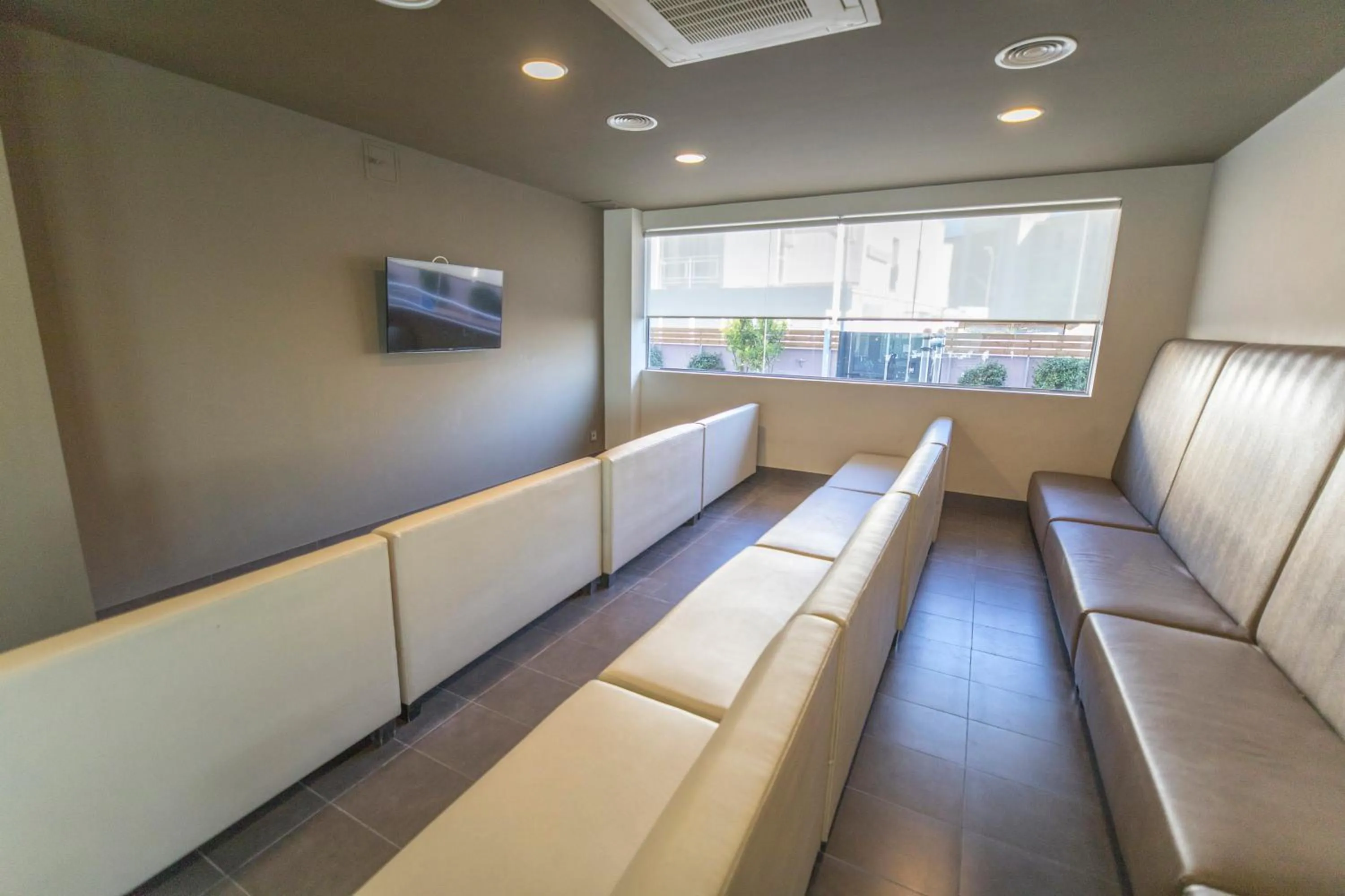 Communal lounge/ TV room in Hotel Augustus