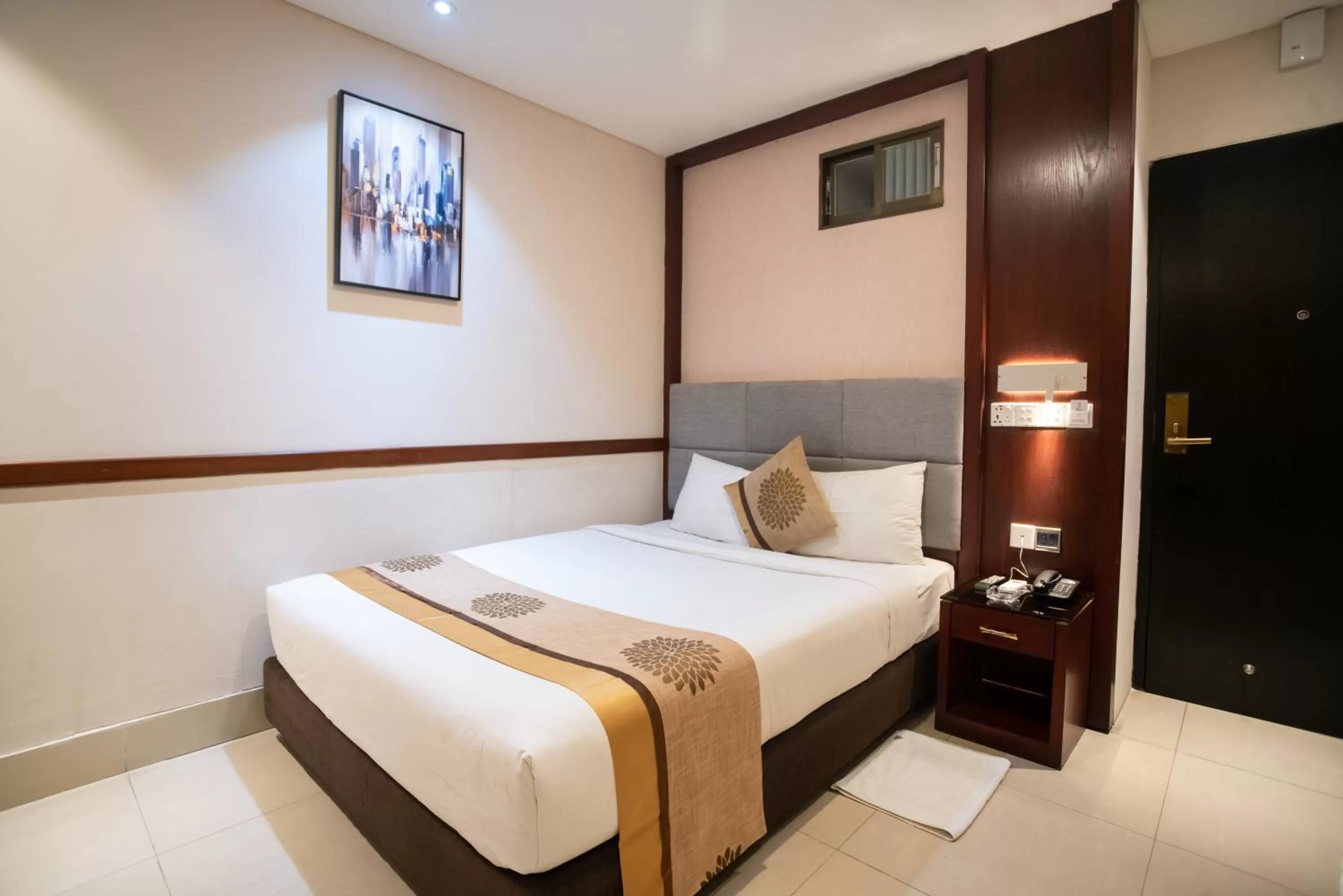 Bed in Jatra Hotel Grand Royal