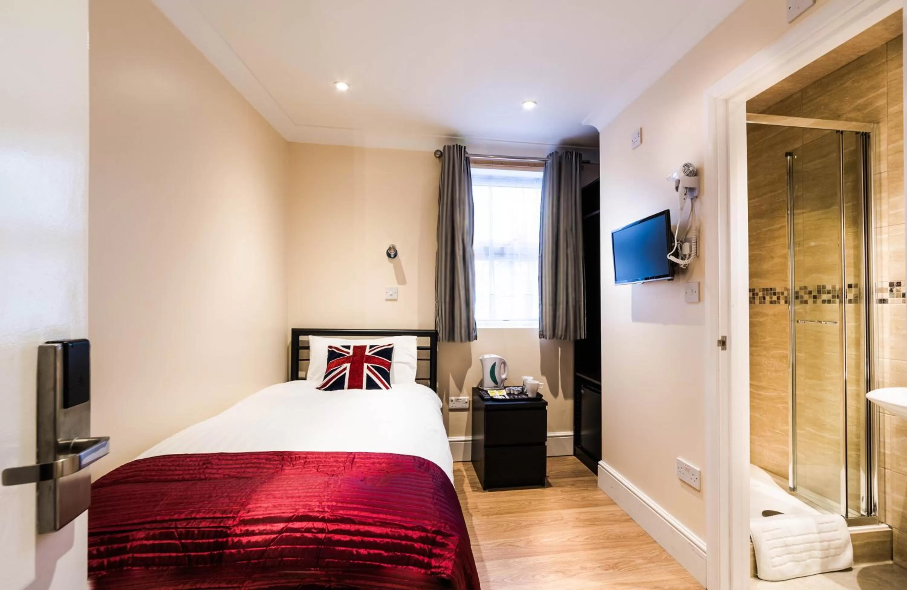 Bed in Hellenic Hotel by Saba