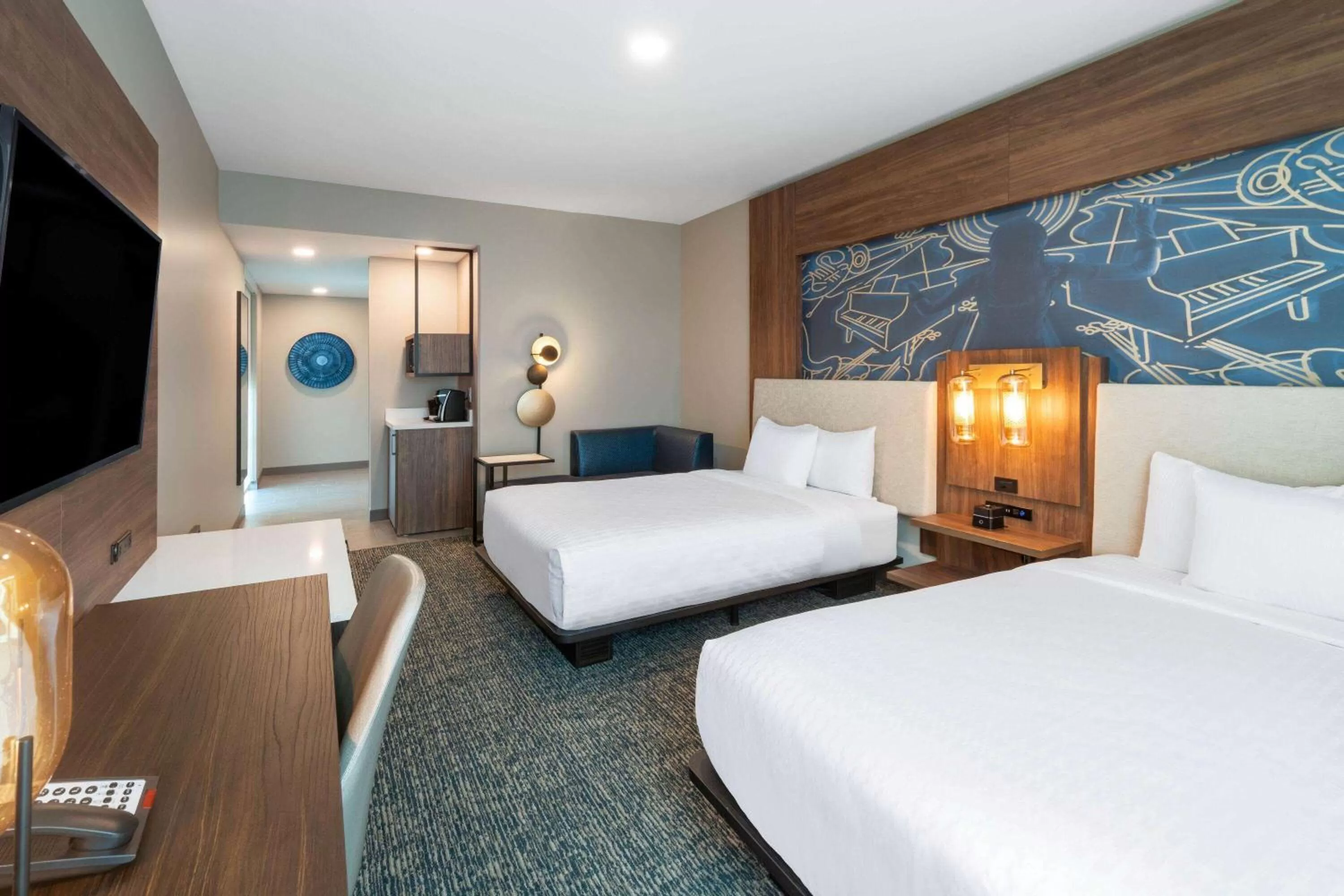 Photo of the whole room, Bed in La Quinta Inn & Suites by Wyndham Nashville Downtown Stadium