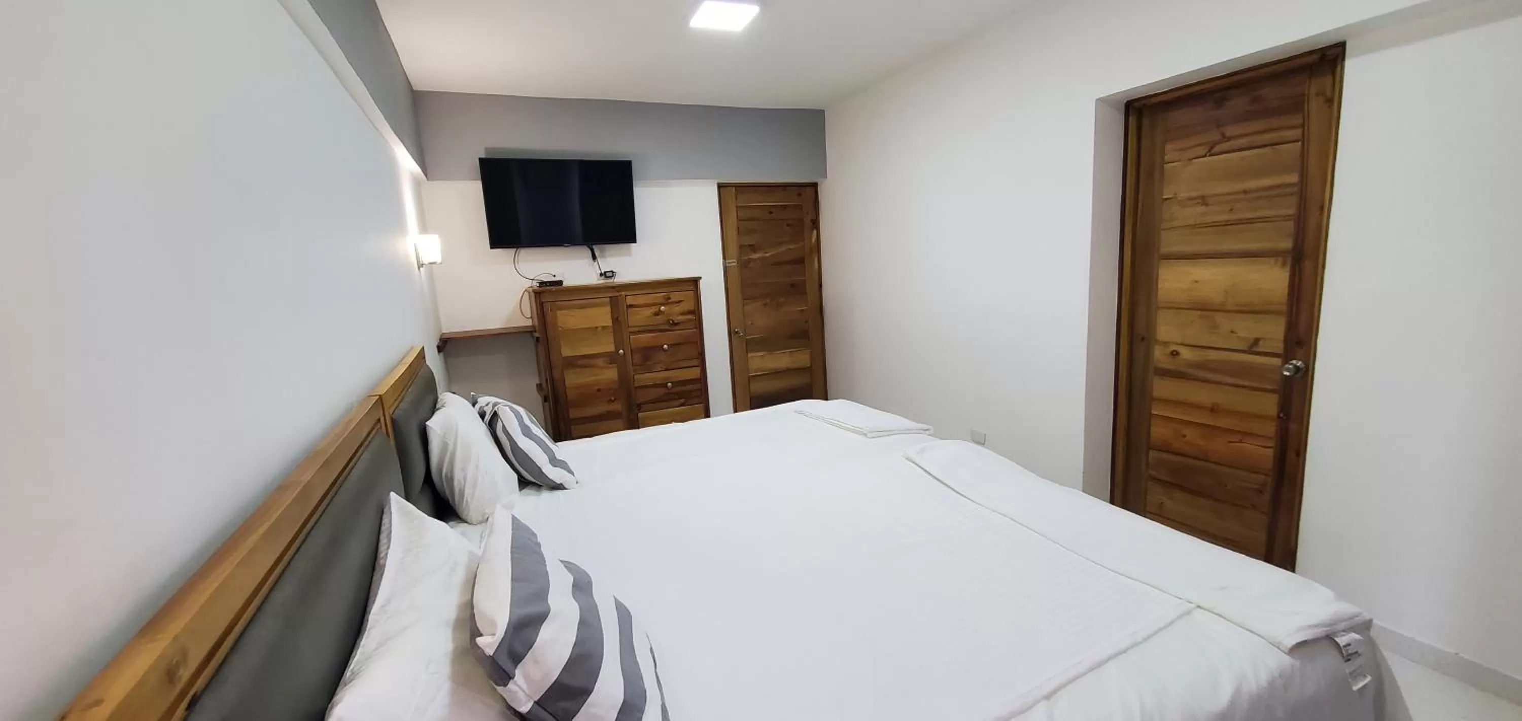 Bed in Boca Grande Hotel Suites