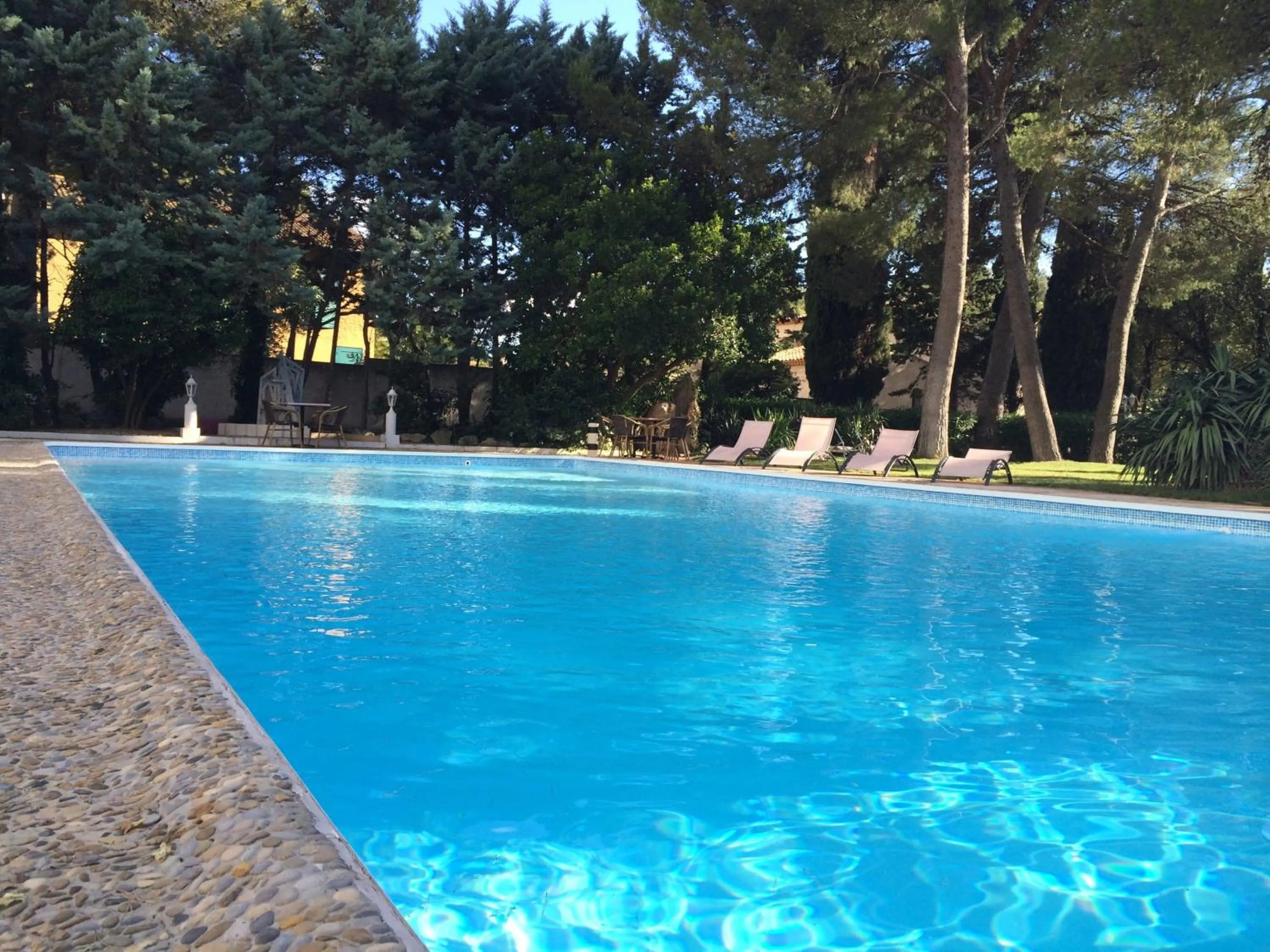 Swimming pool in Cit'Hotel Le Mirage