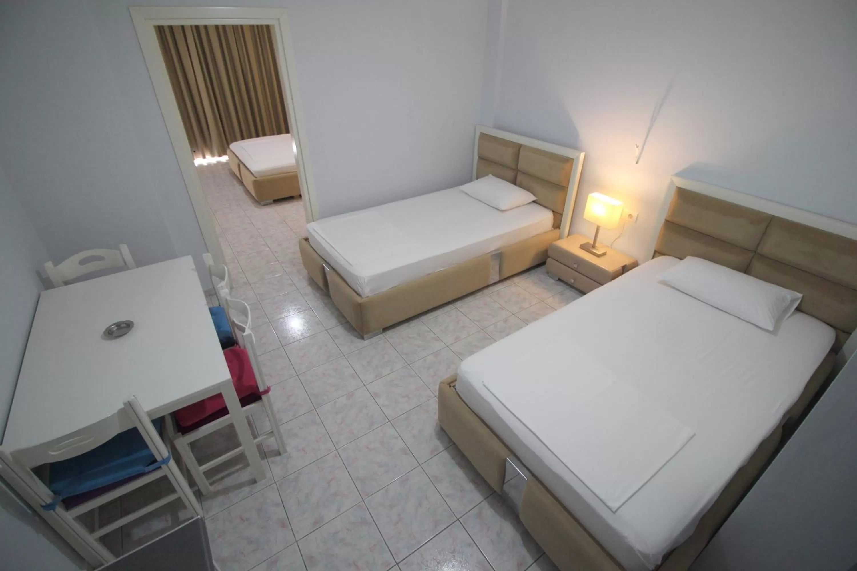 Bed in Murati Suites Sarandë