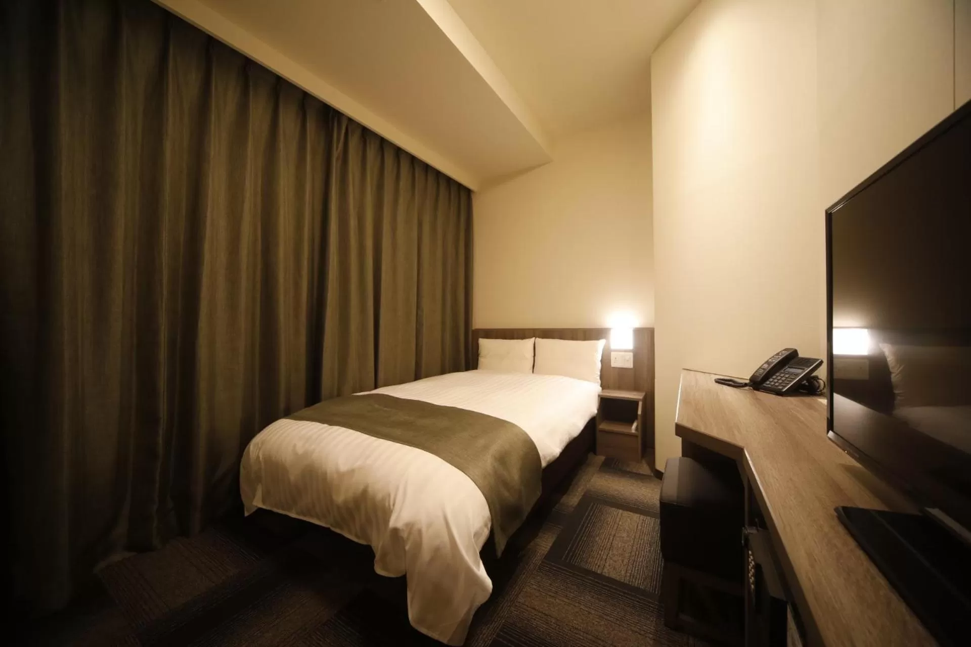 Bed in Dormy Inn Korakuen