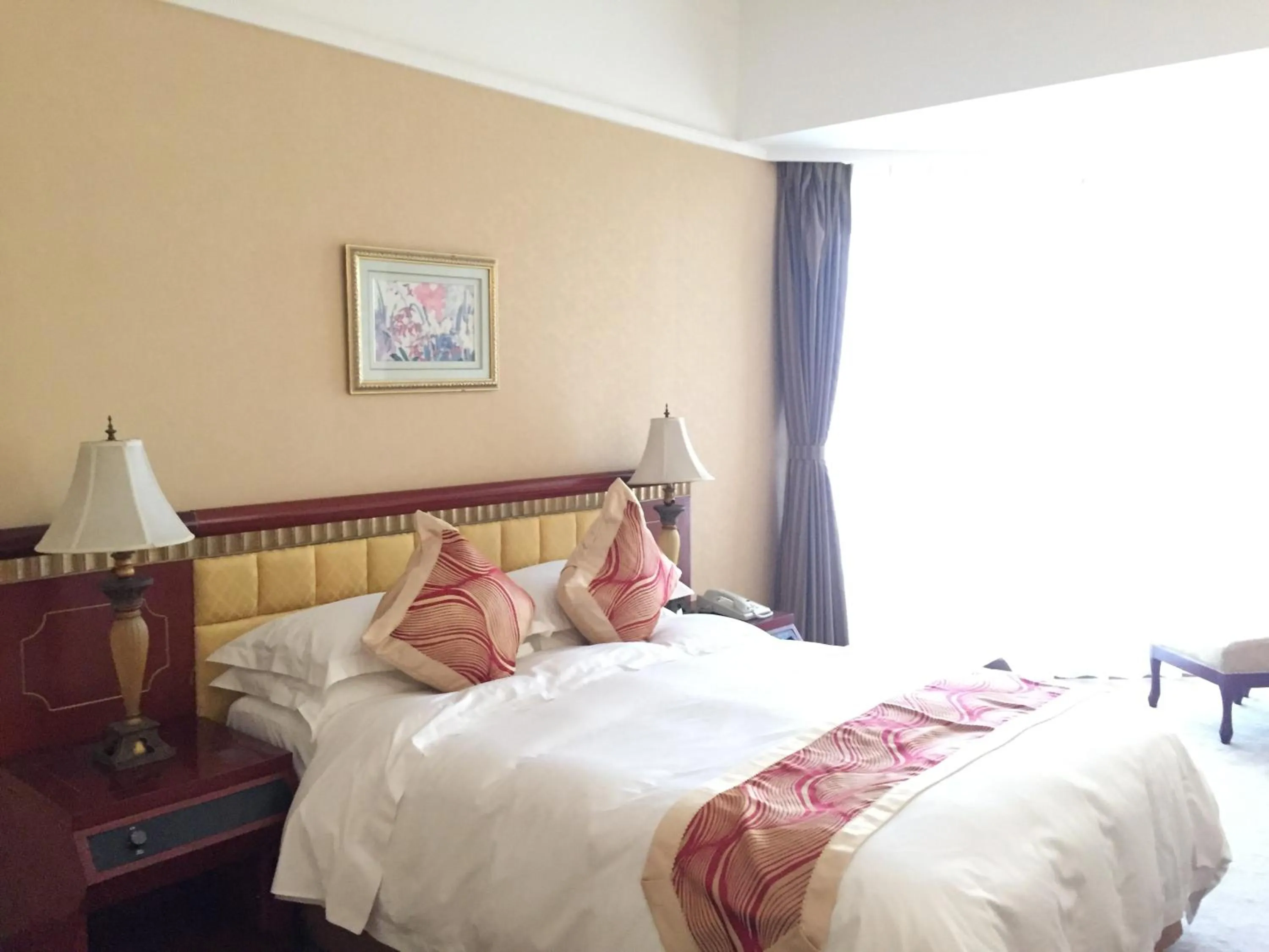 Bed in Huiquan Dynasty Hotel Qingdao
