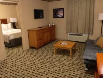 Living room, Bed in Days Inn & Suites by Wyndham Sellersburg