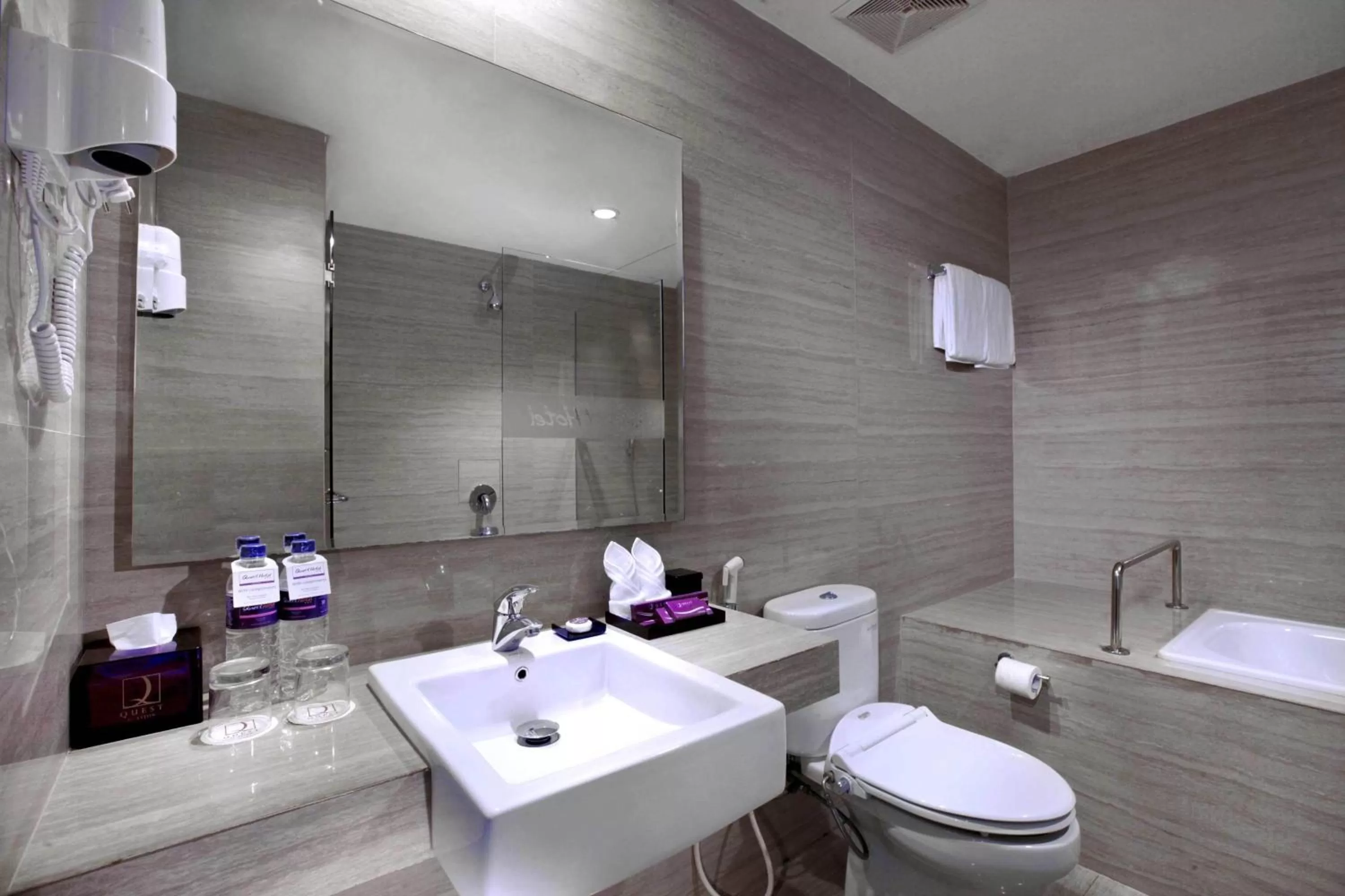 Bathroom in Quest Hotel Balikpapan by ASTON