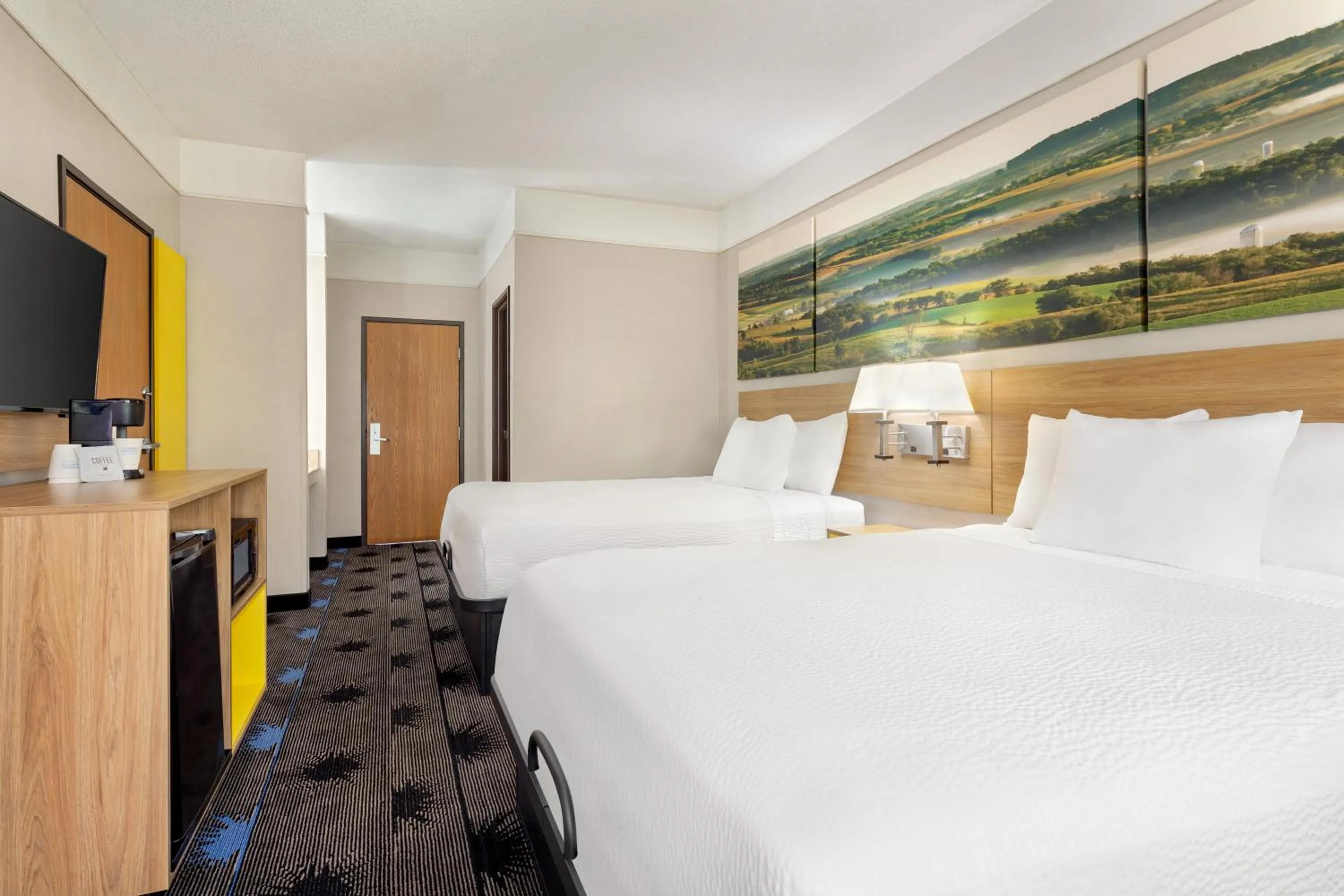 Bed in Days Inn by Wyndham Kansas City International Airport