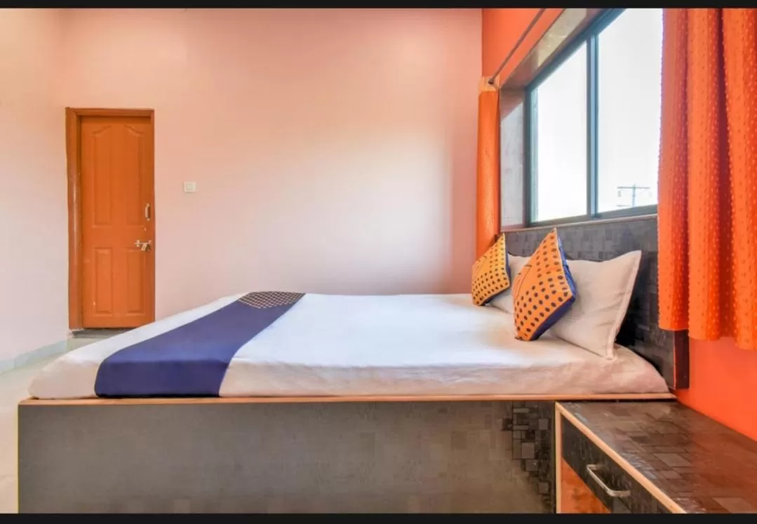 Bed in Hotel Nisarg Lodging And Restaurant