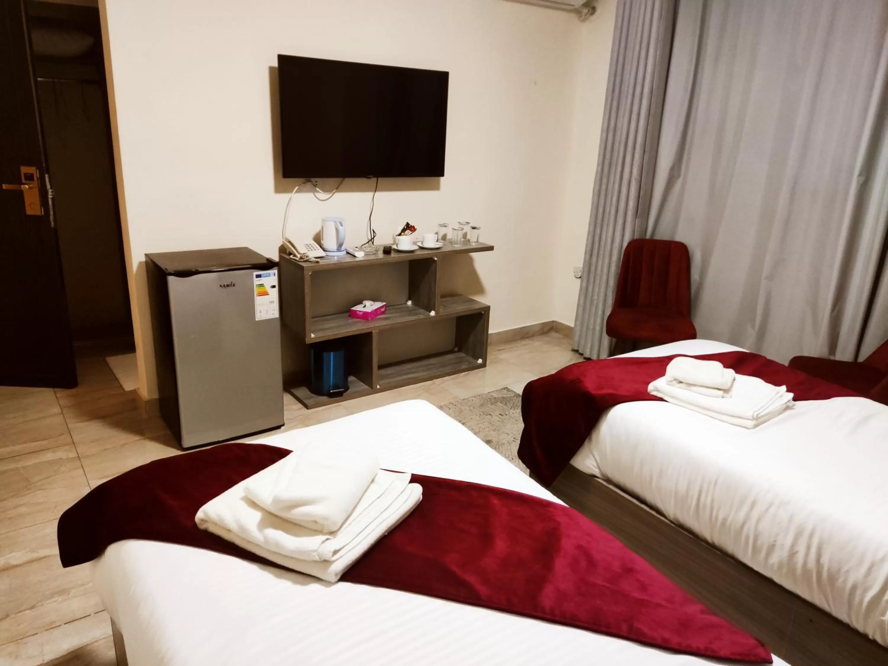 Bed in Golden Plaza Hotel