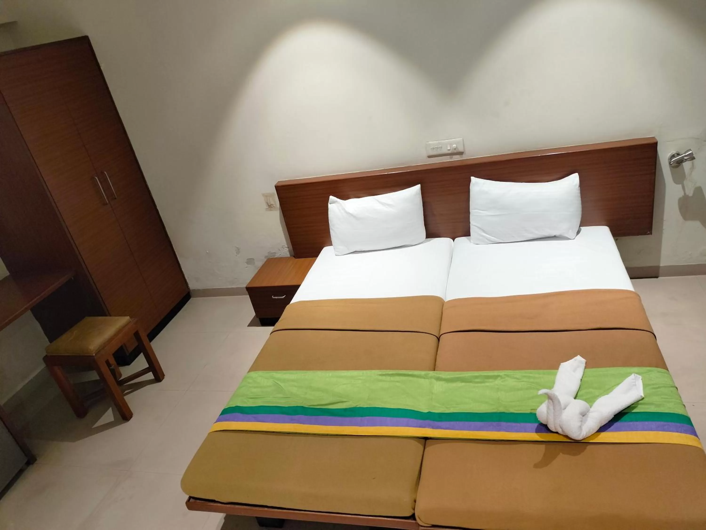 Bed in Hotel Sumanchandra Suites