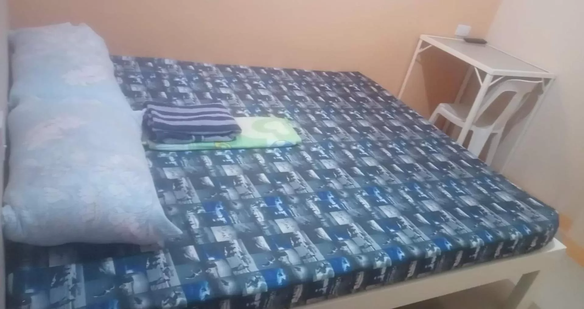 Bed in ROBIE'S TRANSIENTS ROOMS