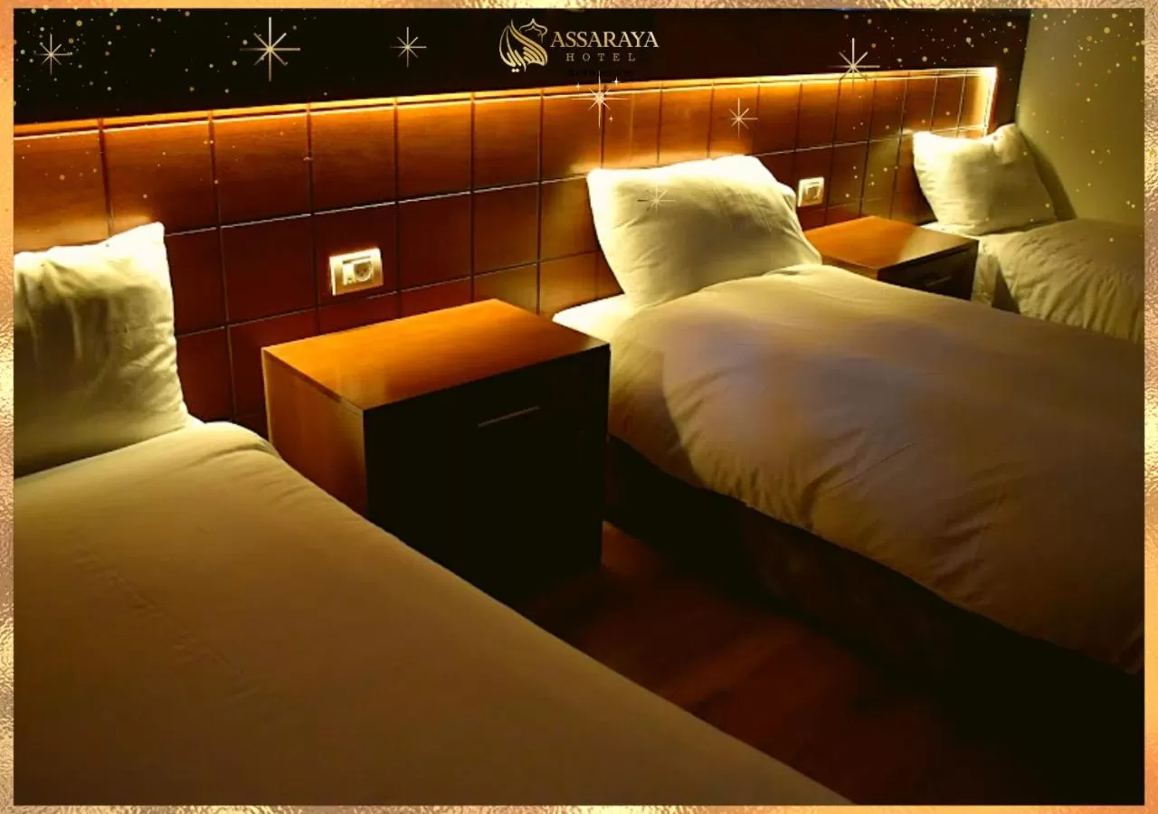 Bed in Assaraya Palace Hotel