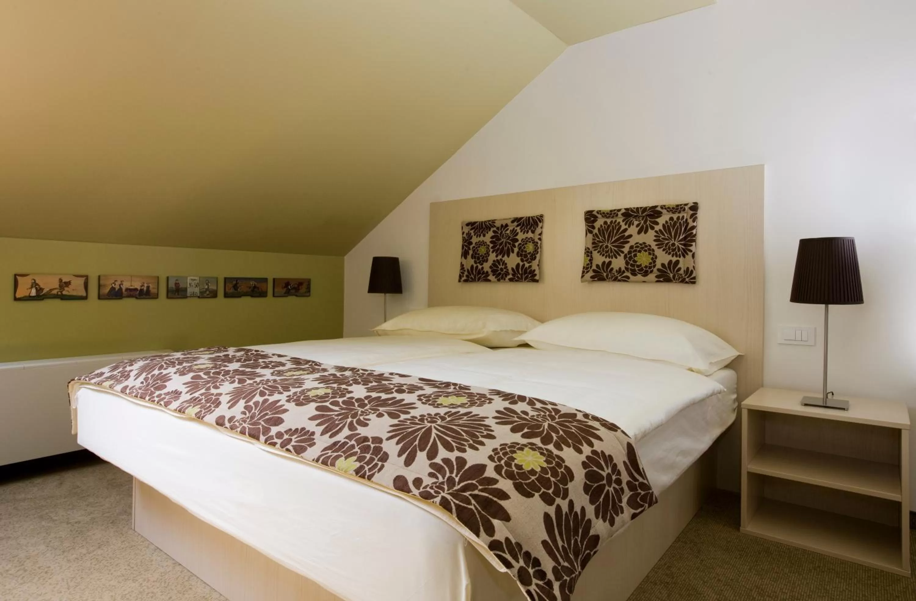 Bed in Ambient Hotel