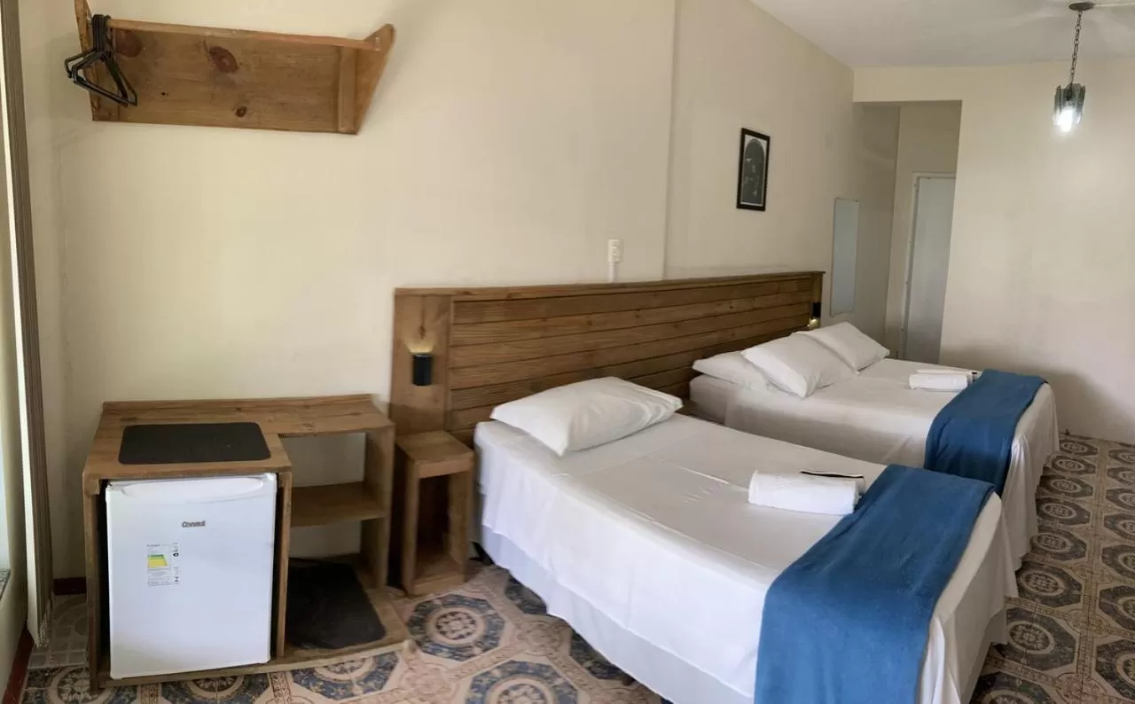 Bed in Pousada Marinamarela