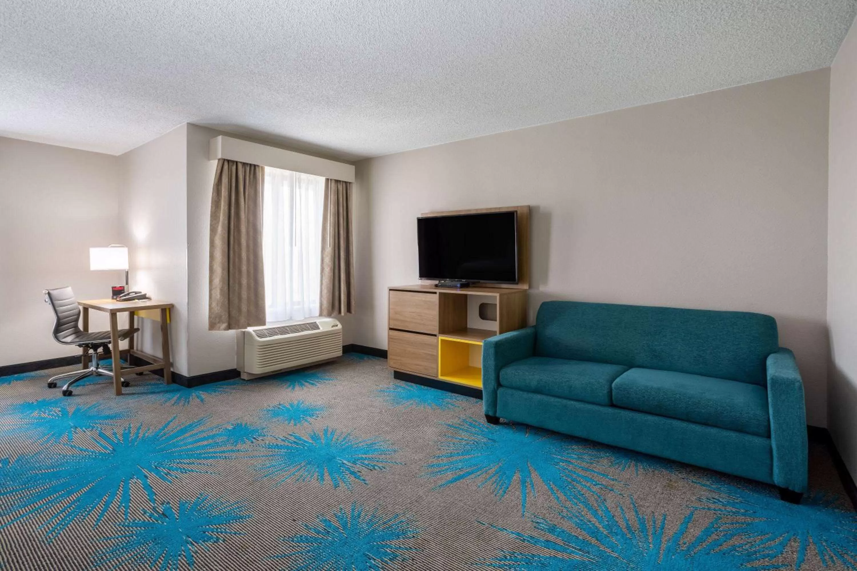 Bed in Days Inn & Suites by Wyndham Denver International Airport