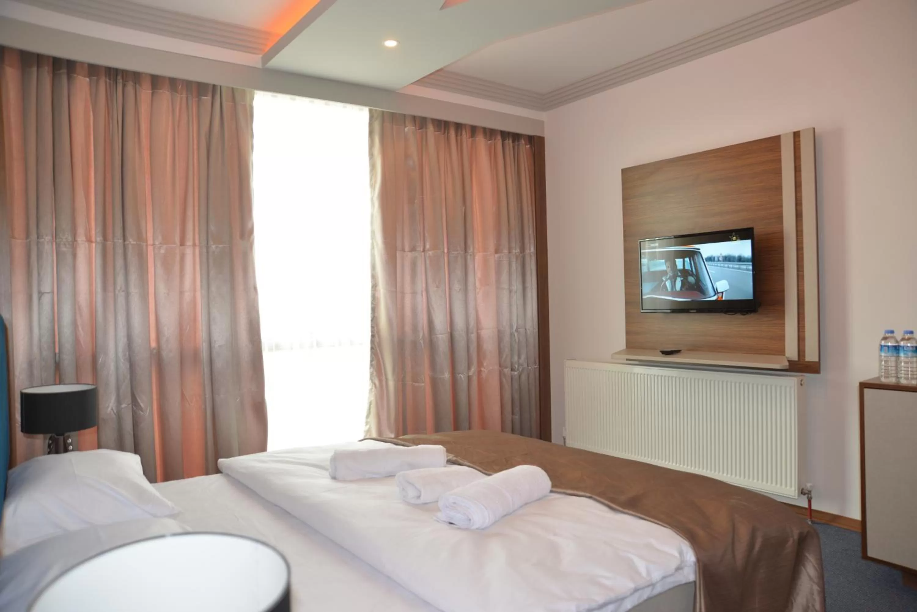 Bed in TEVETOGLU HOTEL