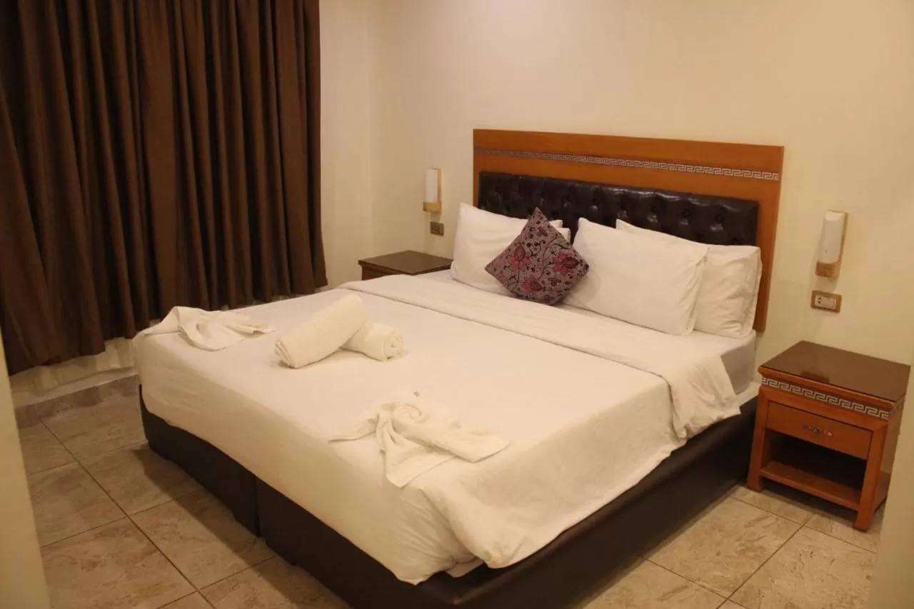 Bed in Jawharet Alswefiah Hotel Suites