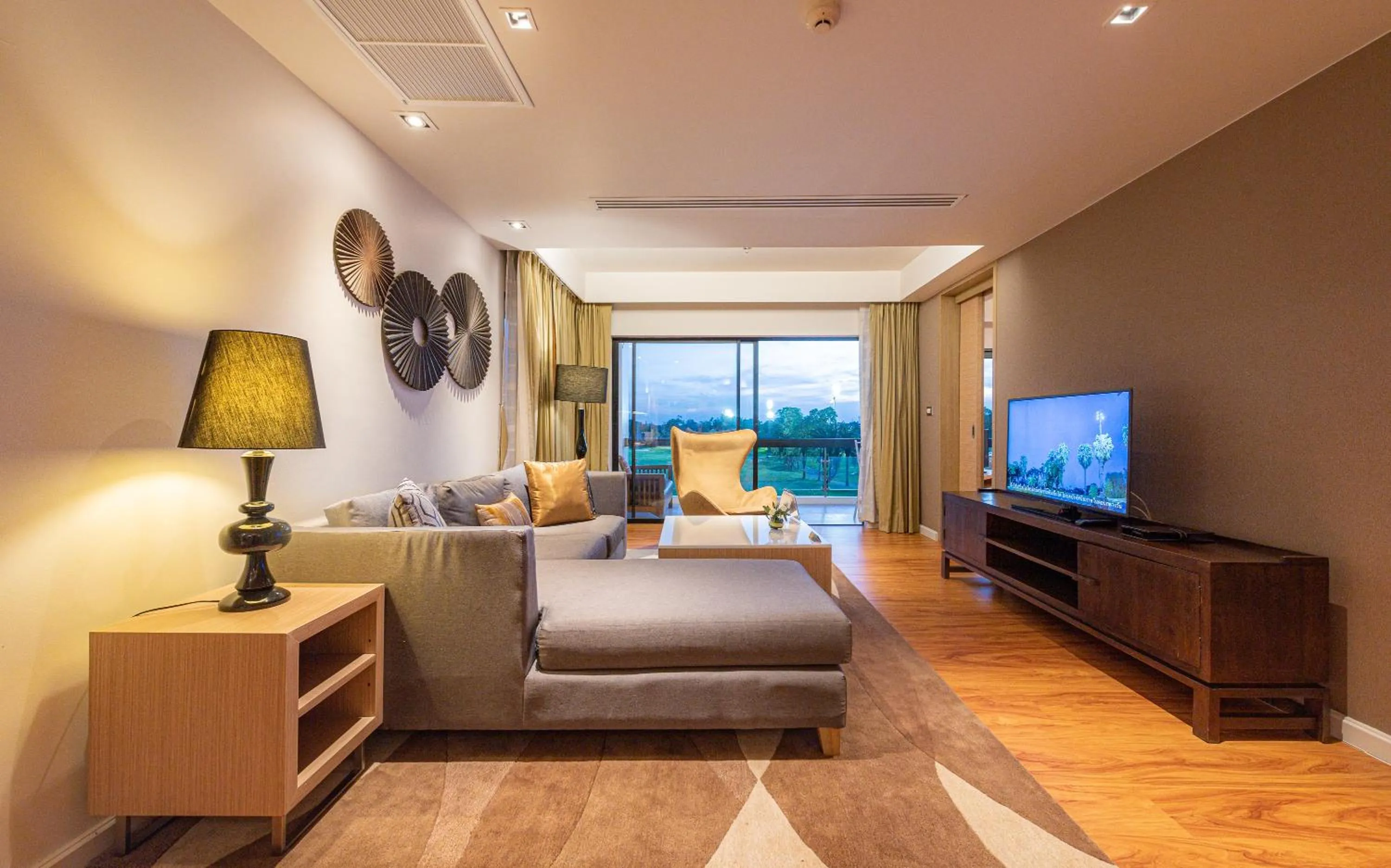 Living room in Summit Windmill Golf Suite Hotel at Suvarnabhumi
