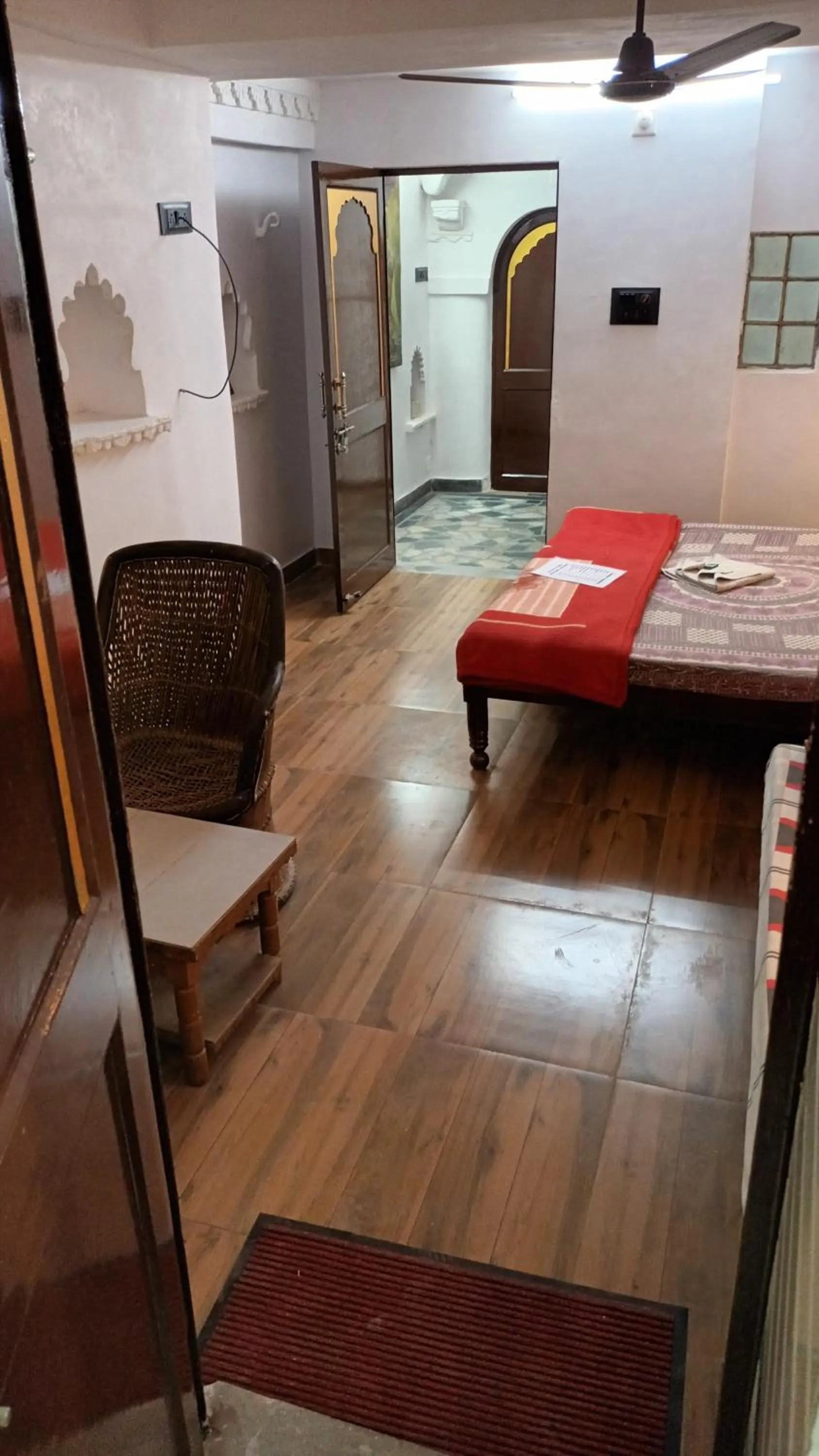 Photo of the whole room, Bed in Jag Niwas Guest House & pure veg restaurant