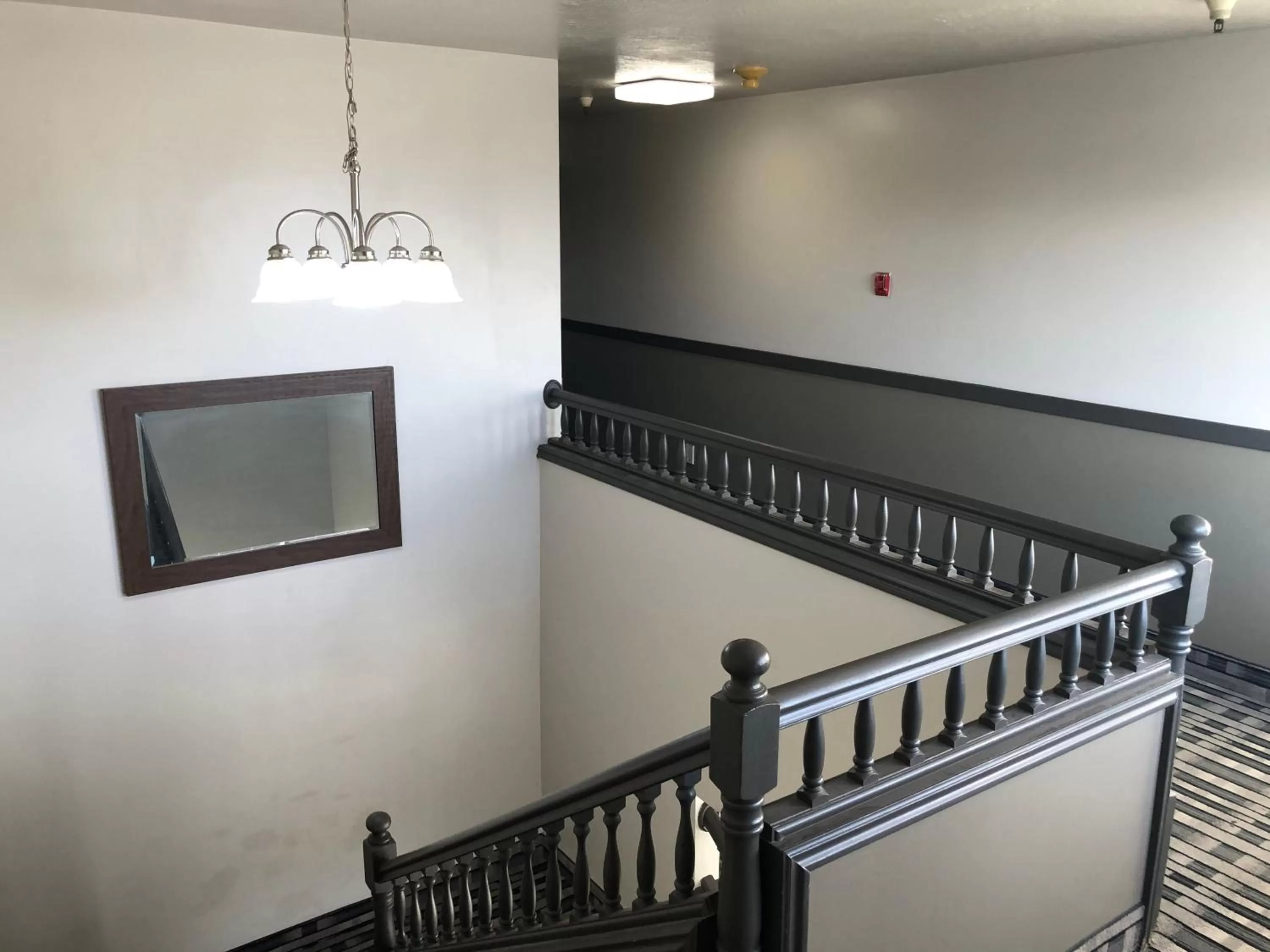 Bed in Ameri-Stay Inn & Suites