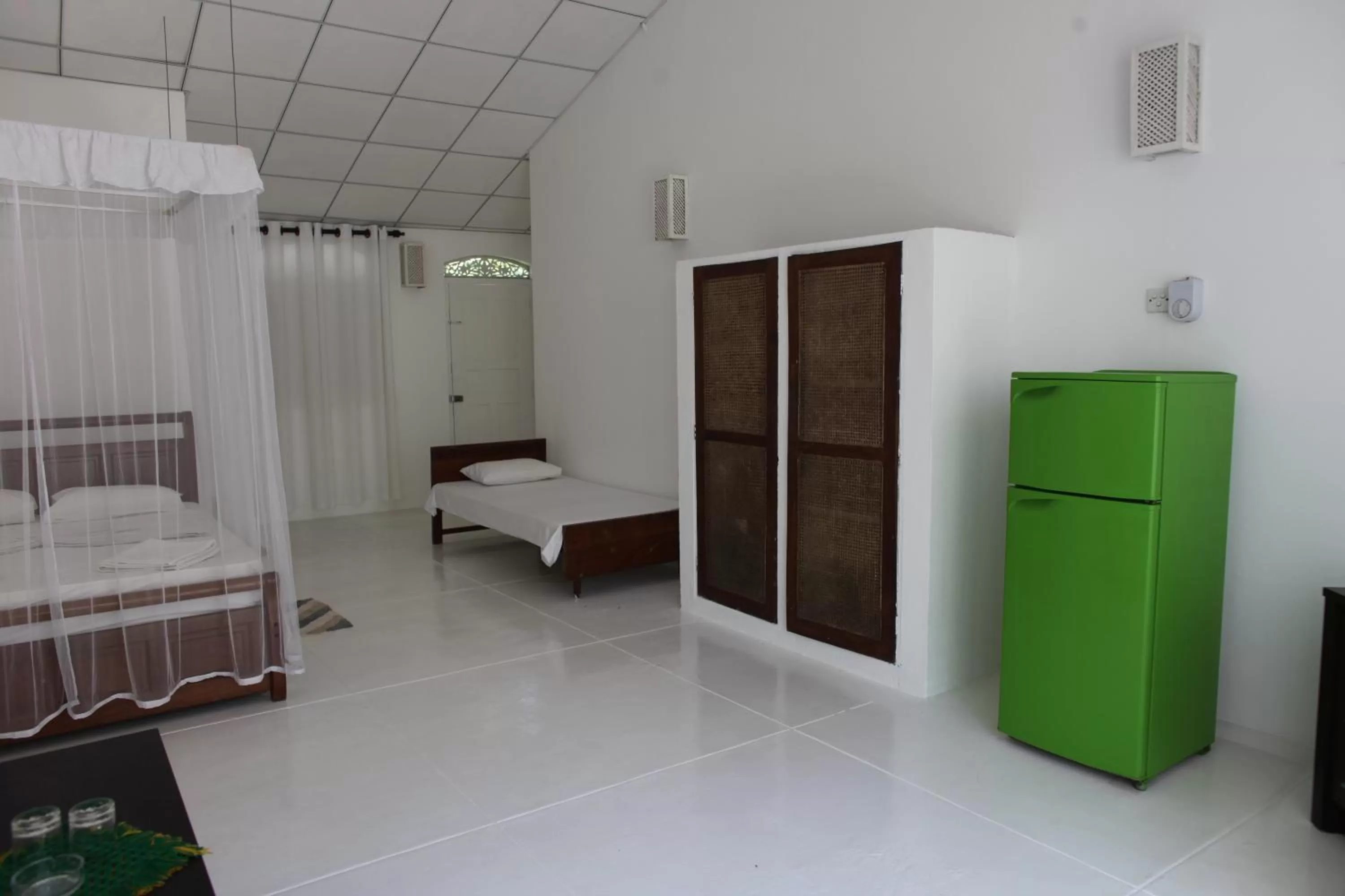 Photo of the whole room, Bed in Chitra Ayurveda