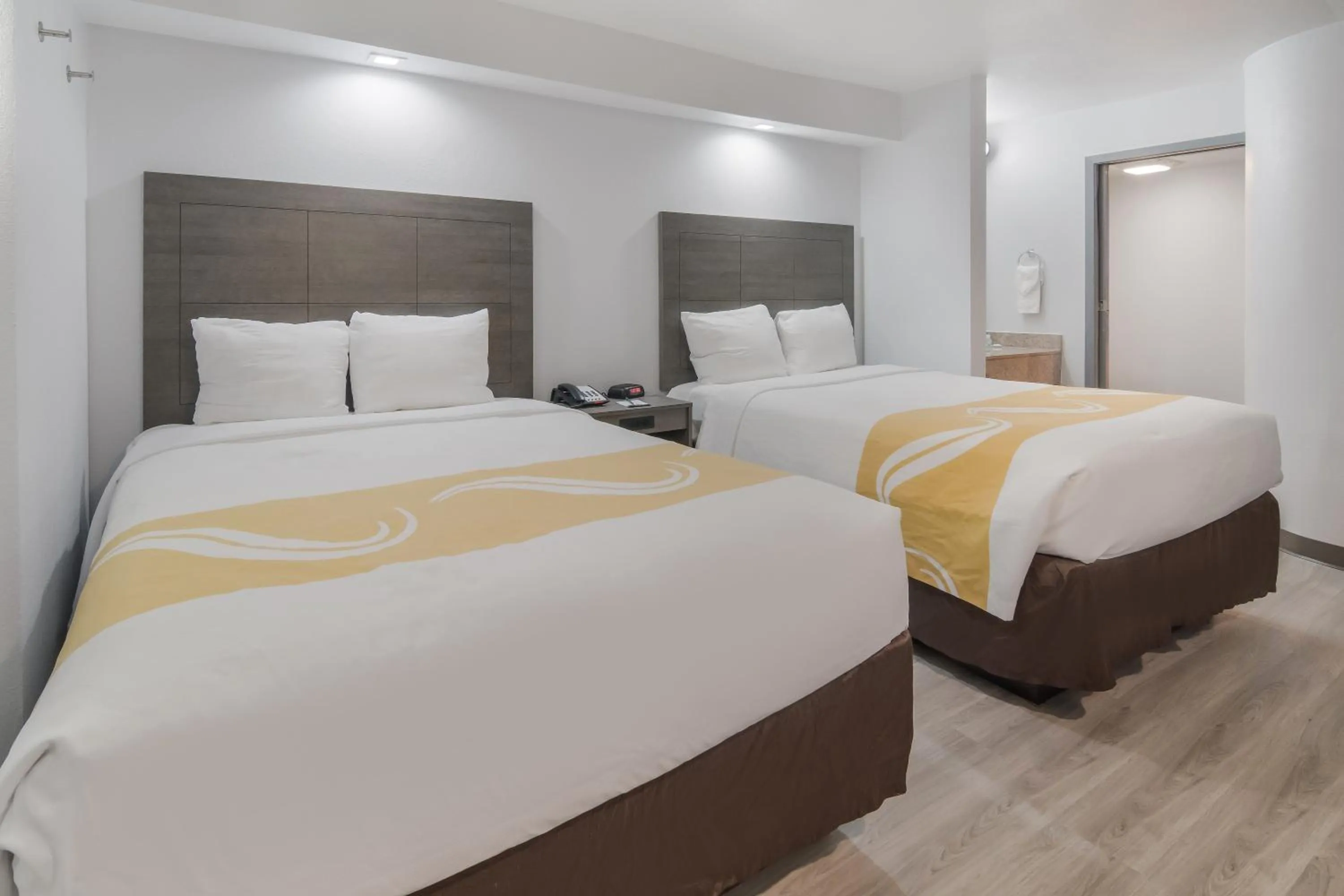 Bed in Quality Inn & Suites Richardson-Dallas