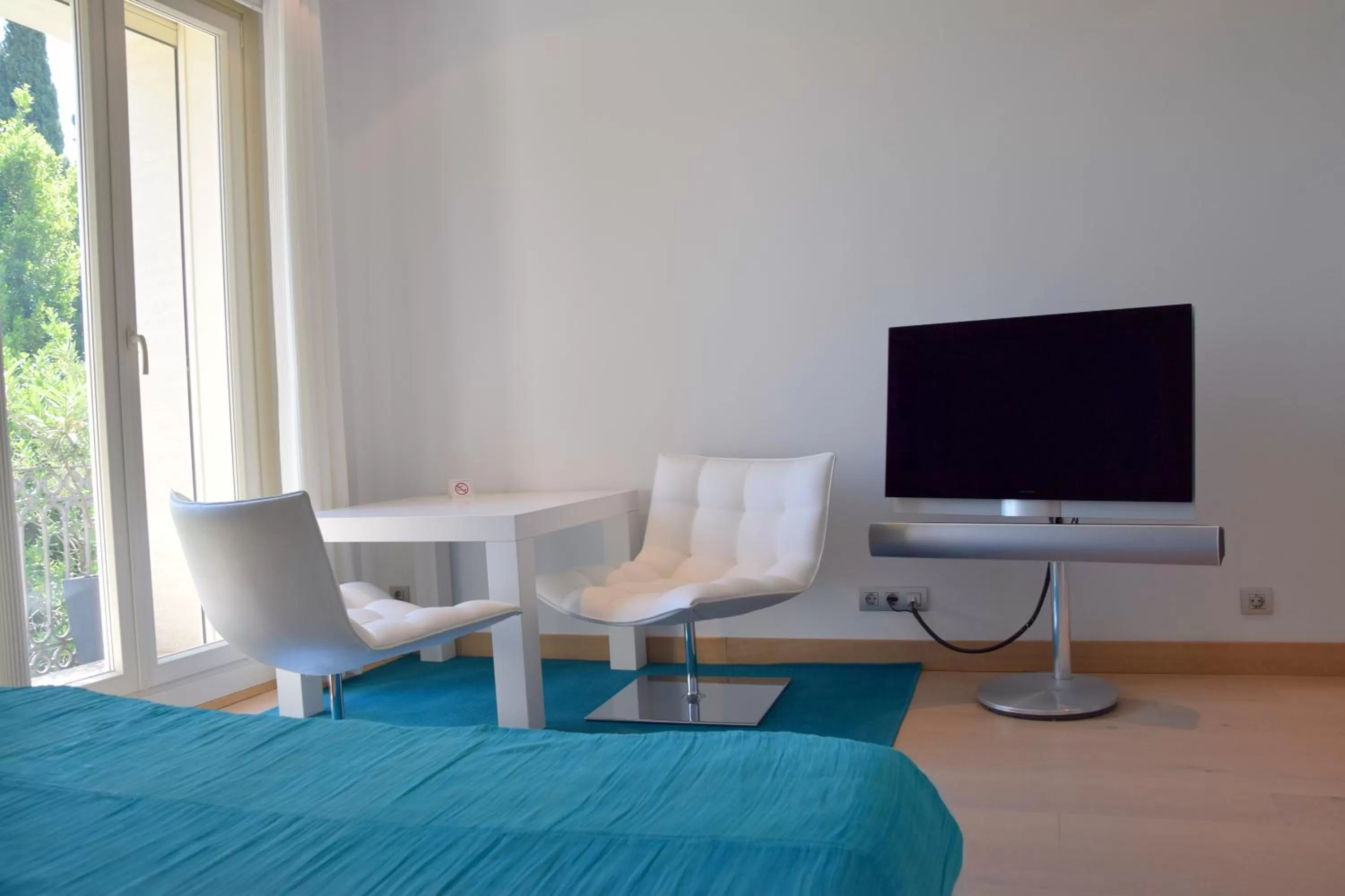 Bed, TV/Entertainment Center in Hotel Ferrero - Singular's Hotels