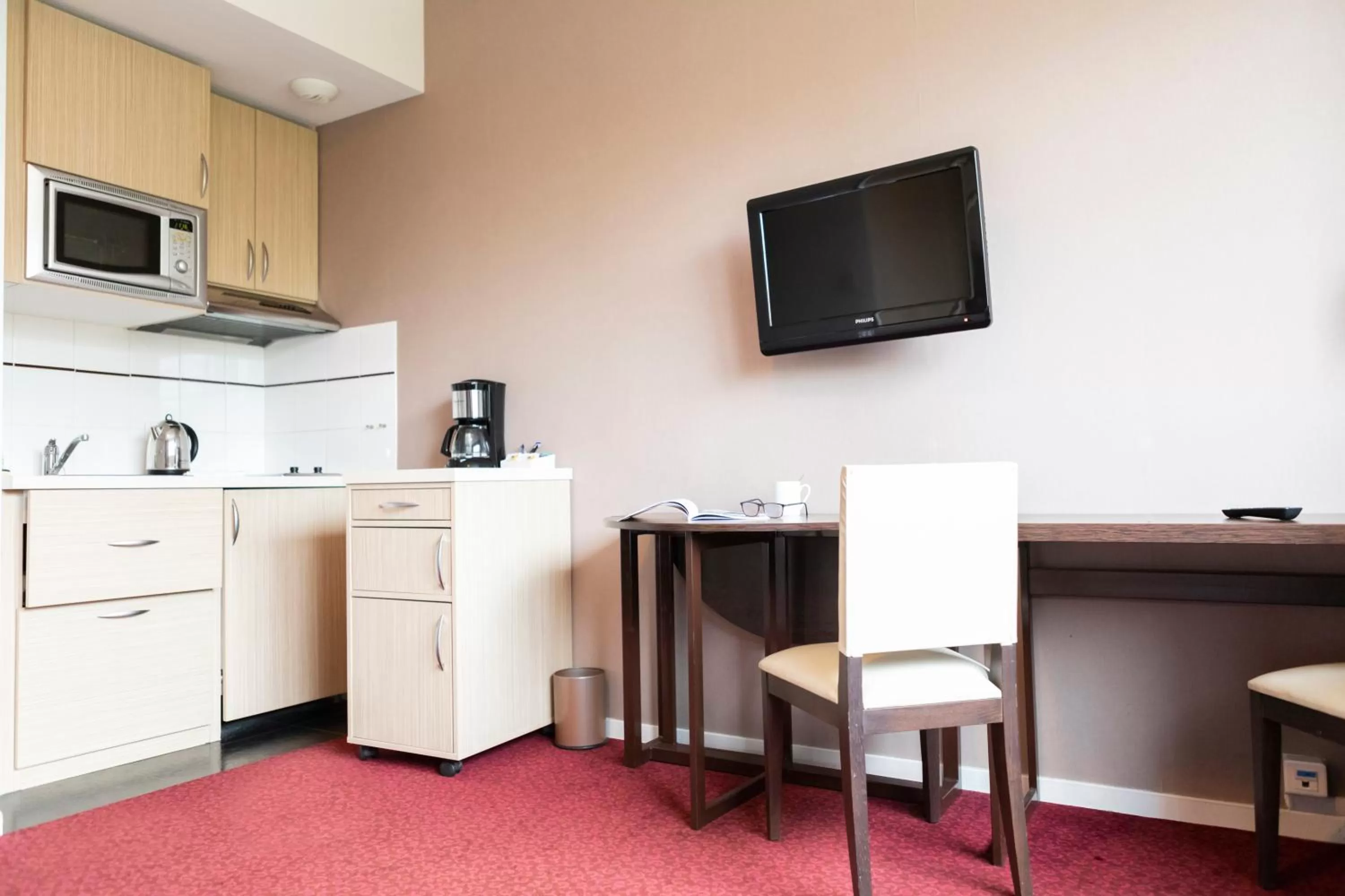 Seating area in Residence KOSY appart'hôtels - Les Cèdres