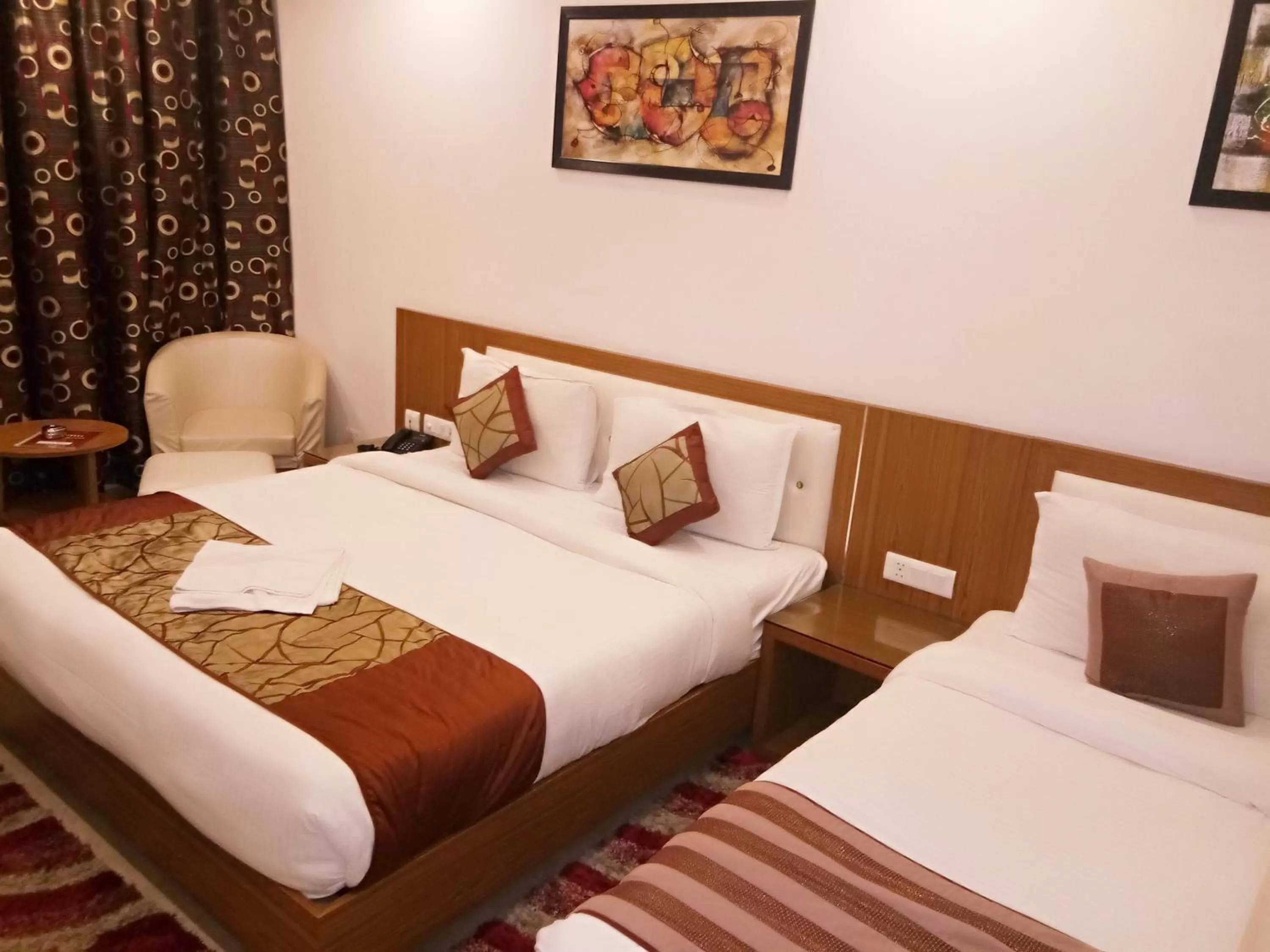 Bed in Hotel Suktara International