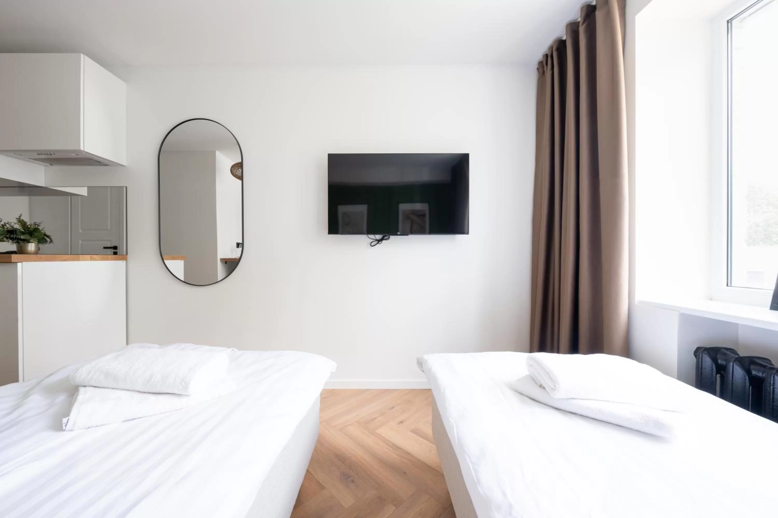 Bed in Oasis Airport Studios by RevalHome