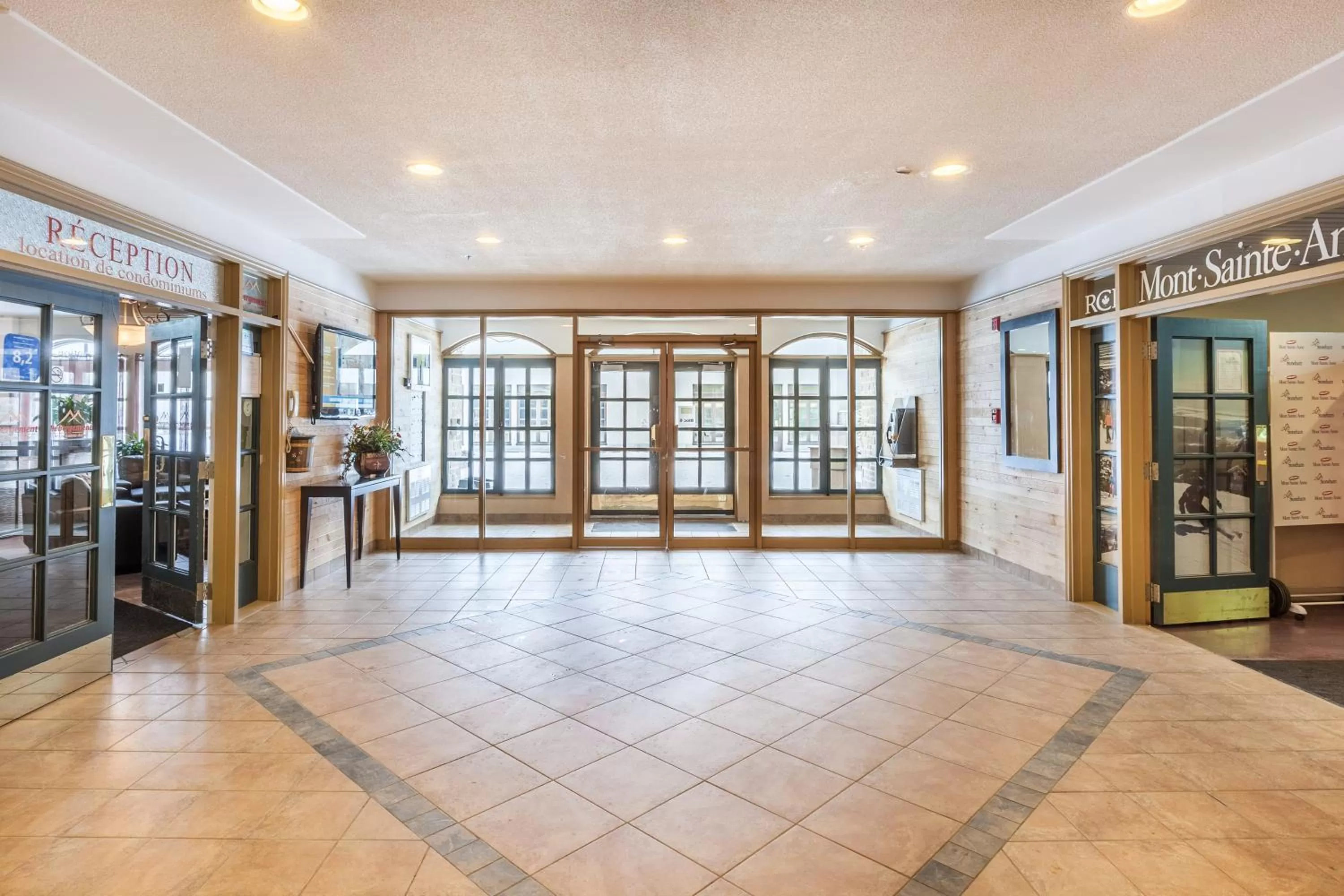 Property logo or sign in Hébergement Mont-Ste-Anne Condos