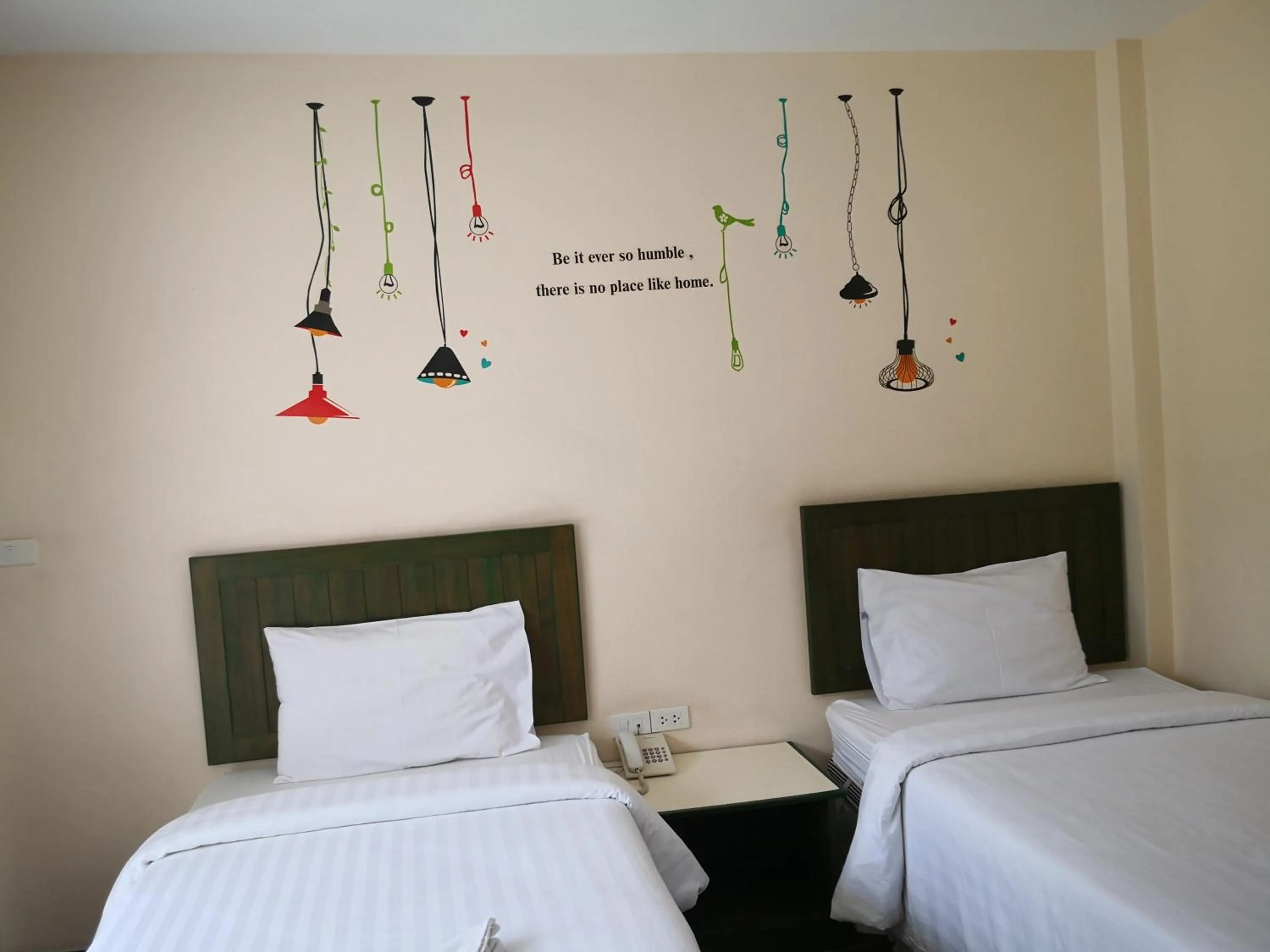 Bed in Baan Suksiri Hotel