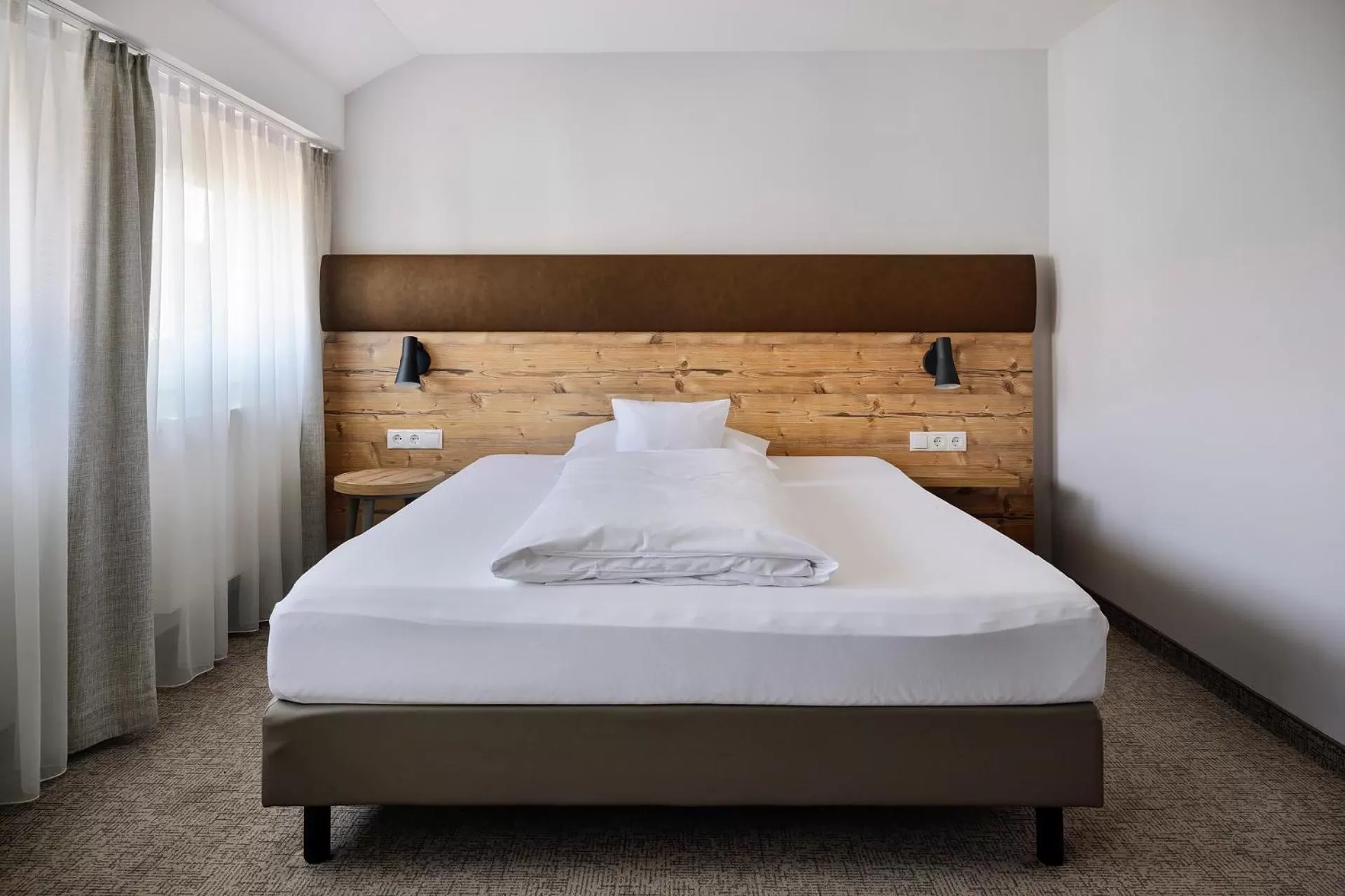 Bed in ApartHotel Rose