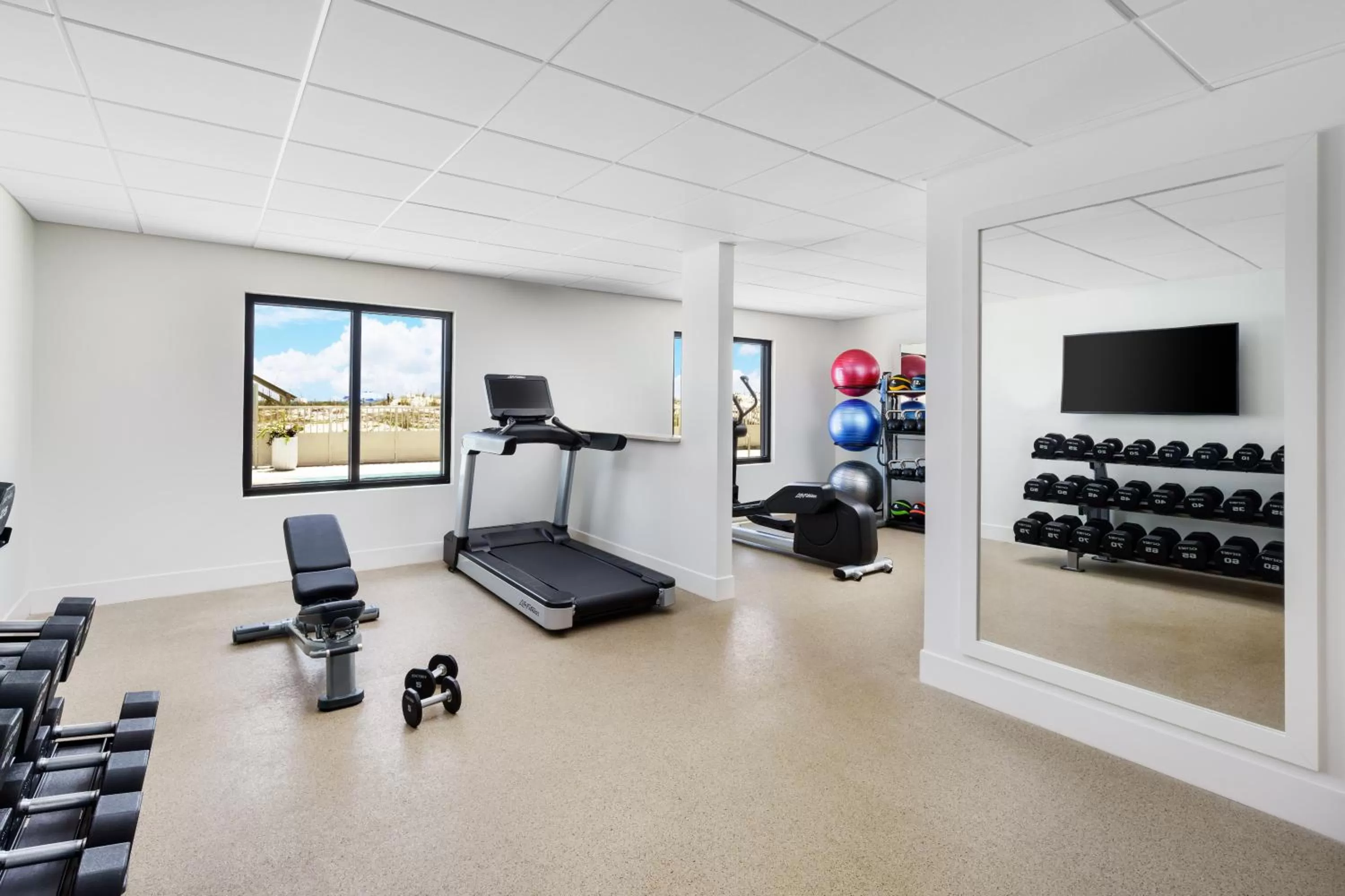 Fitness centre/facilities in Beal House Fort Walton Beach, Tapestry Collection By Hilton
